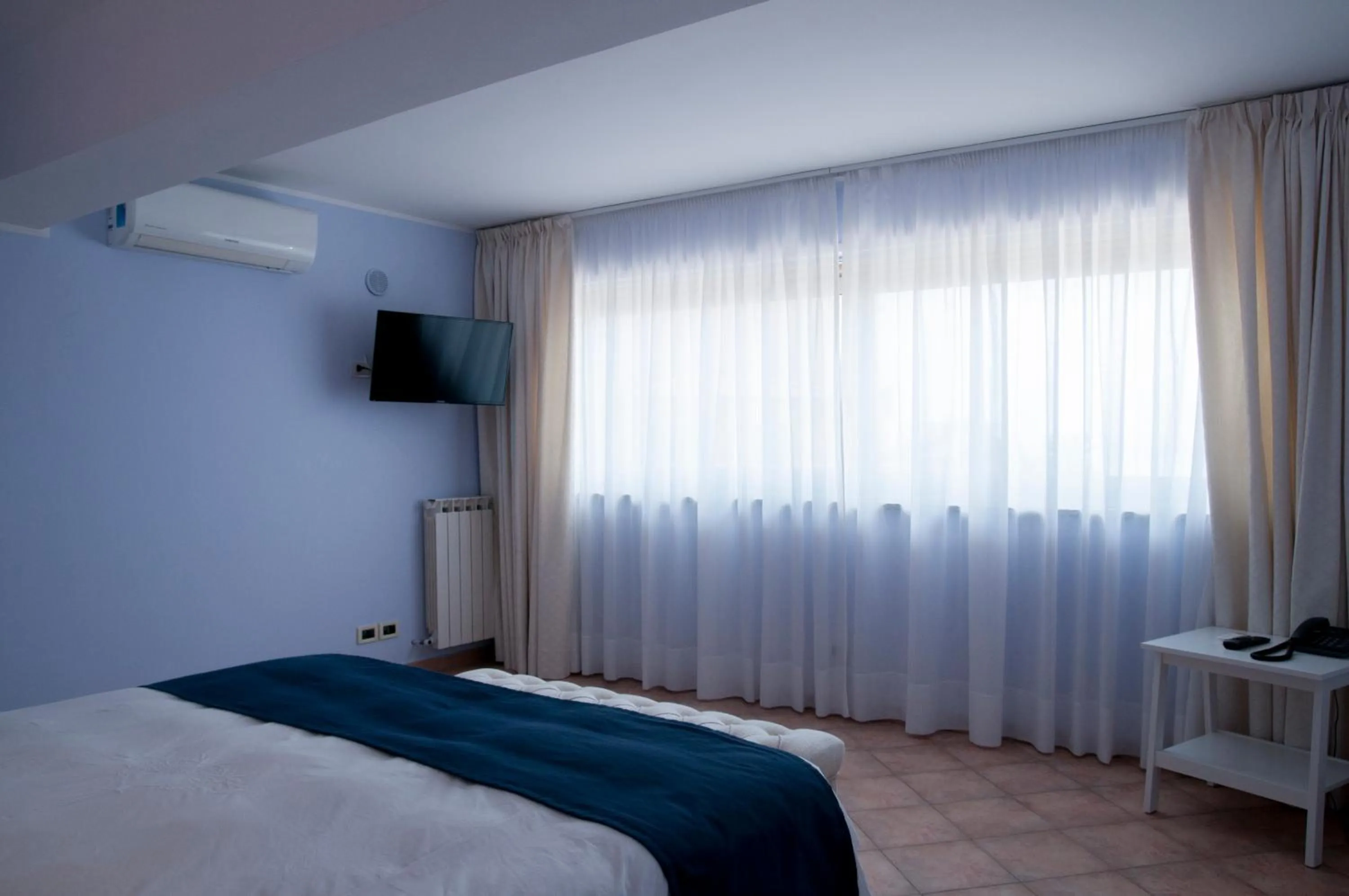 Bed in Villa Le Terrazze Charming Rooms