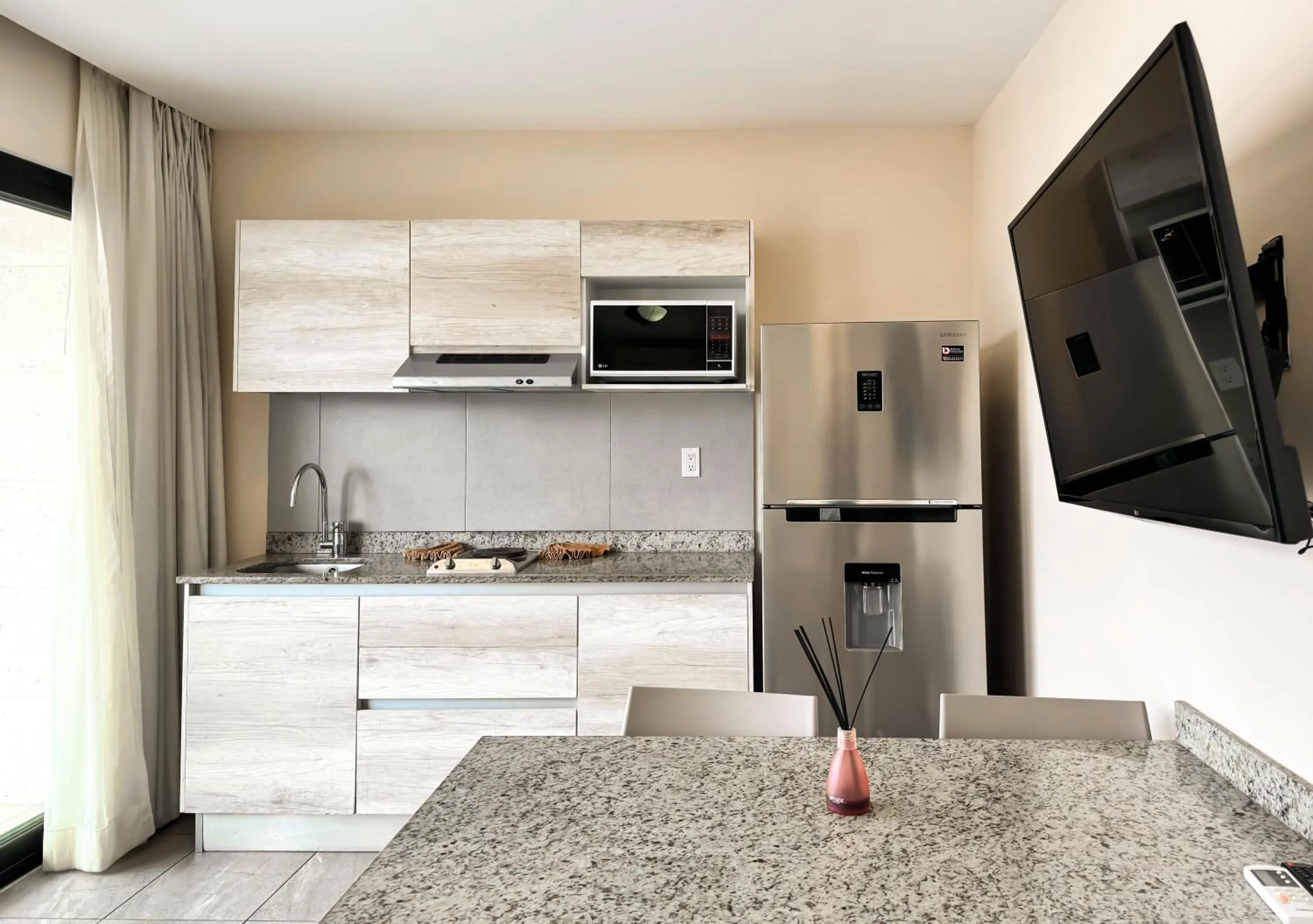 Kitchen or kitchenette in Grand Fifty Suites