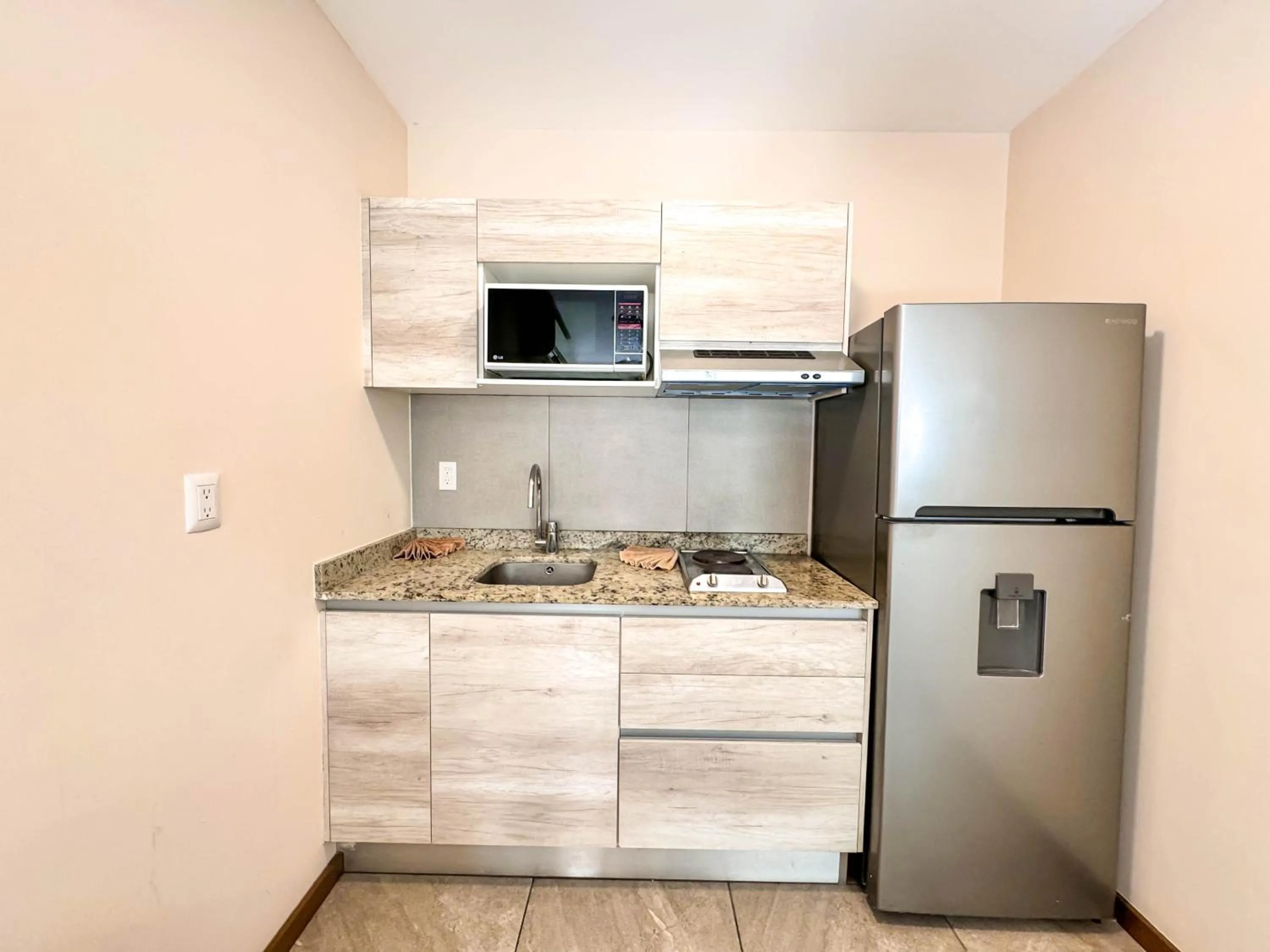 Kitchen or kitchenette in Grand Fifty Suites