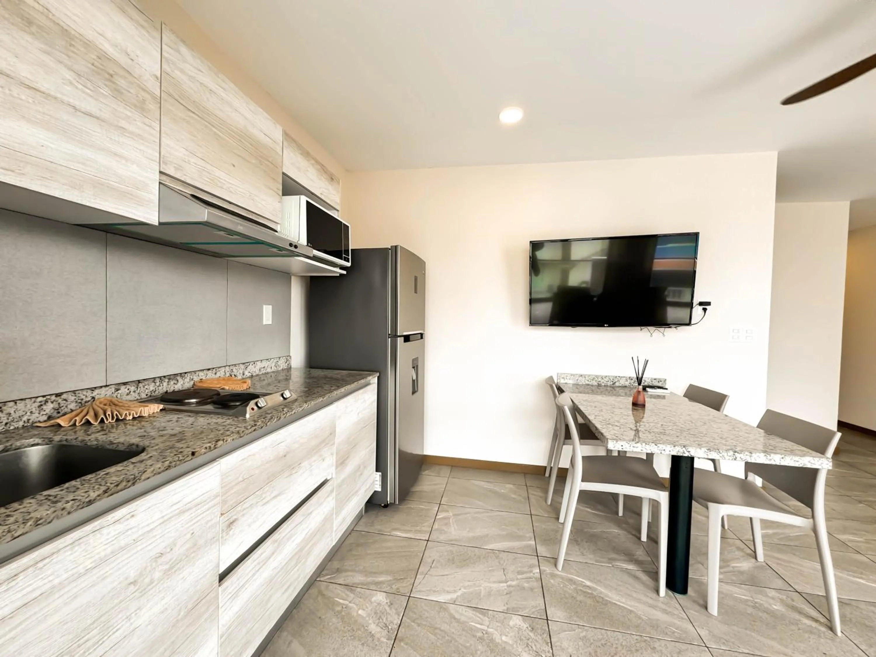 Kitchen or kitchenette in Grand Fifty Suites