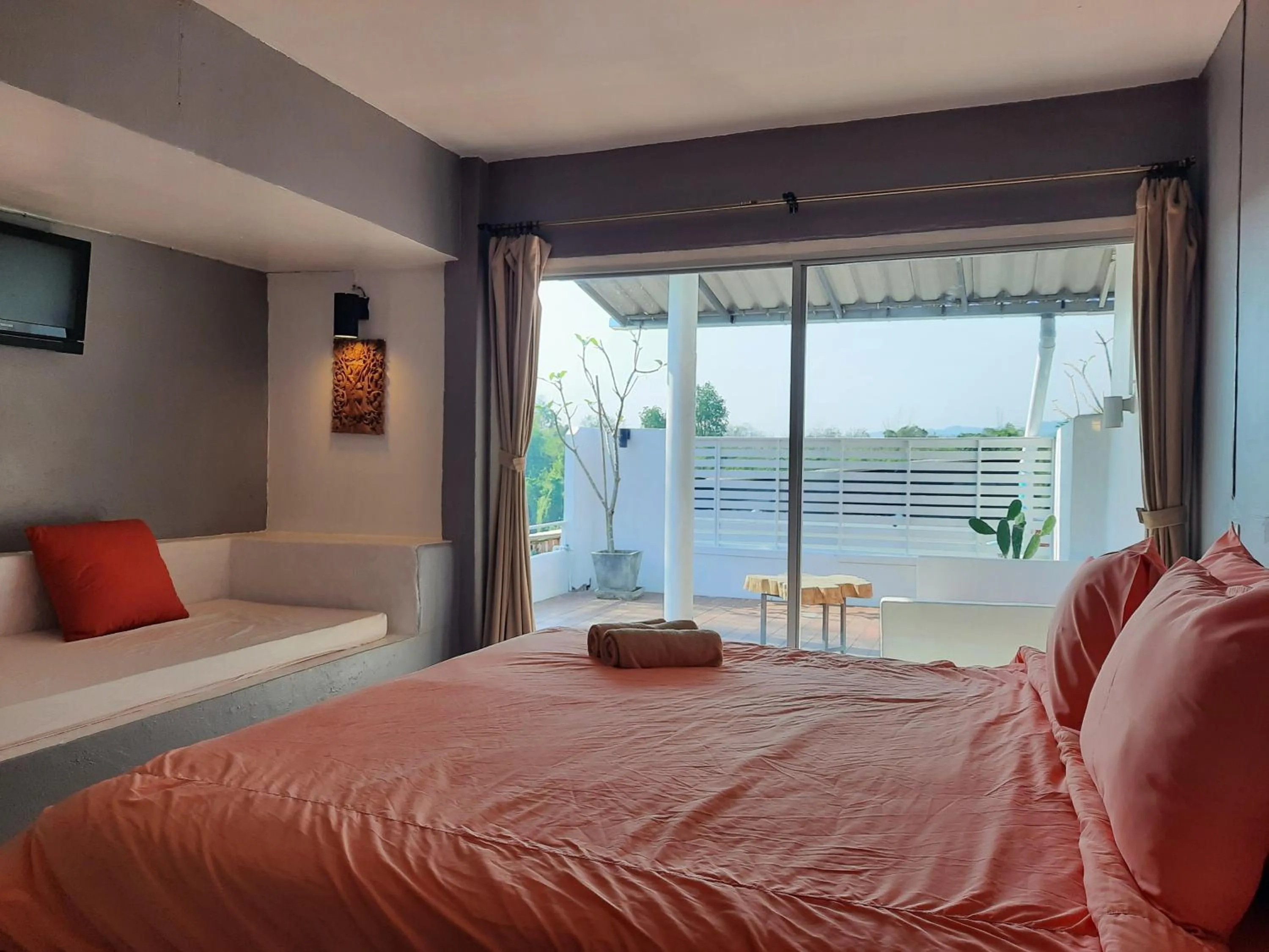 Bed in Chasorn Riverside Resort