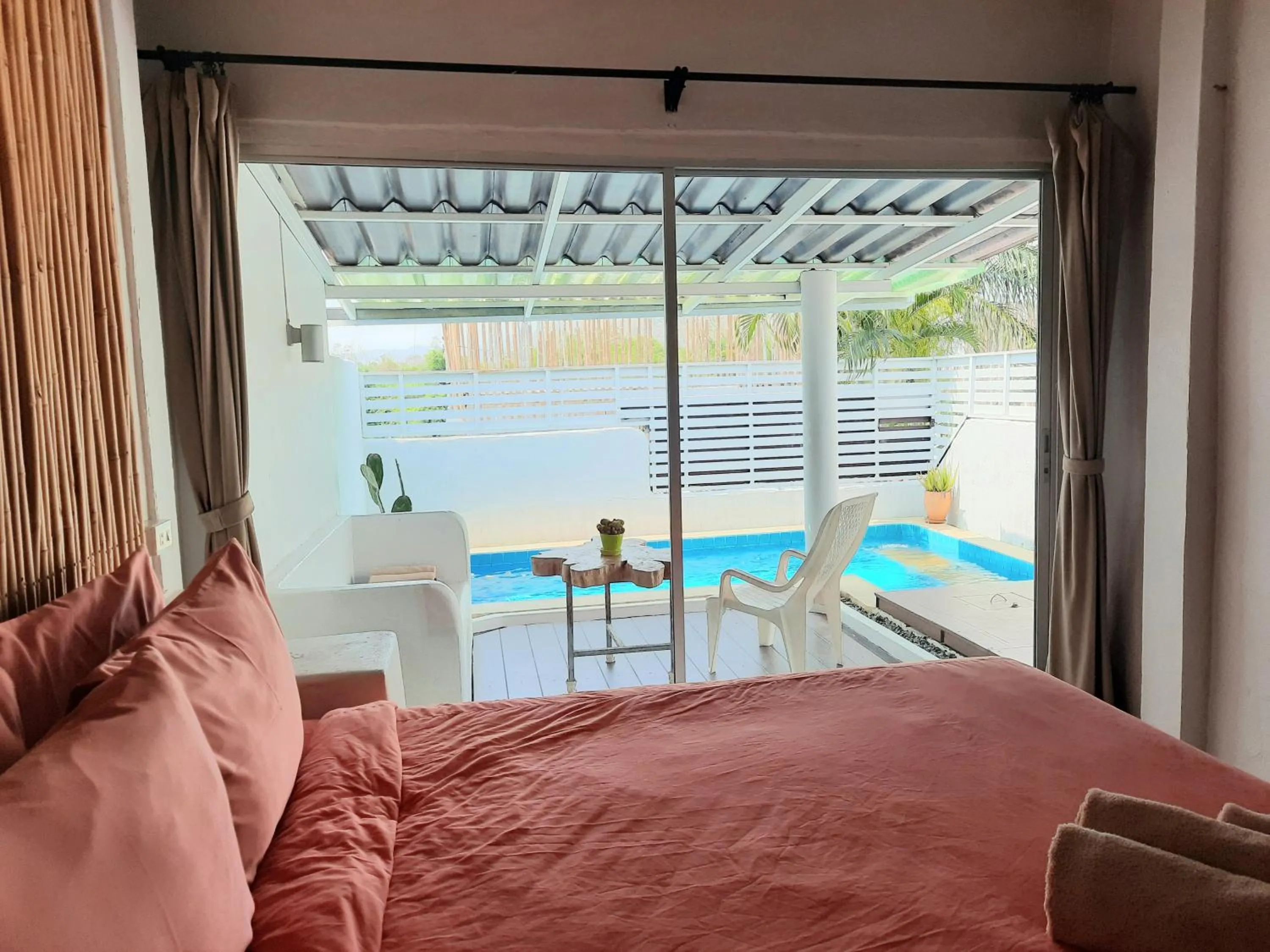 Bed in Chasorn Riverside Resort