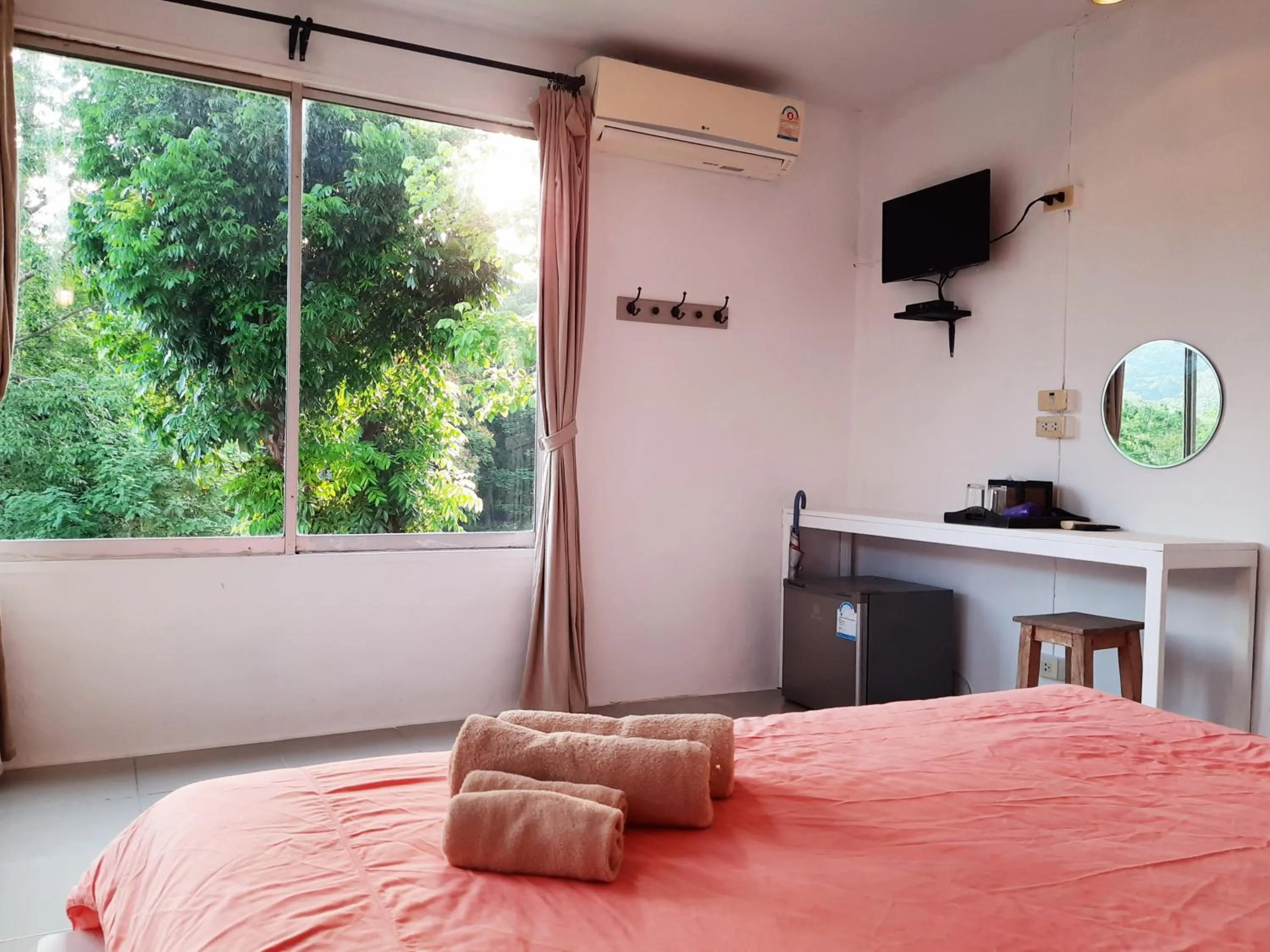 Bed in Chasorn Riverside Resort