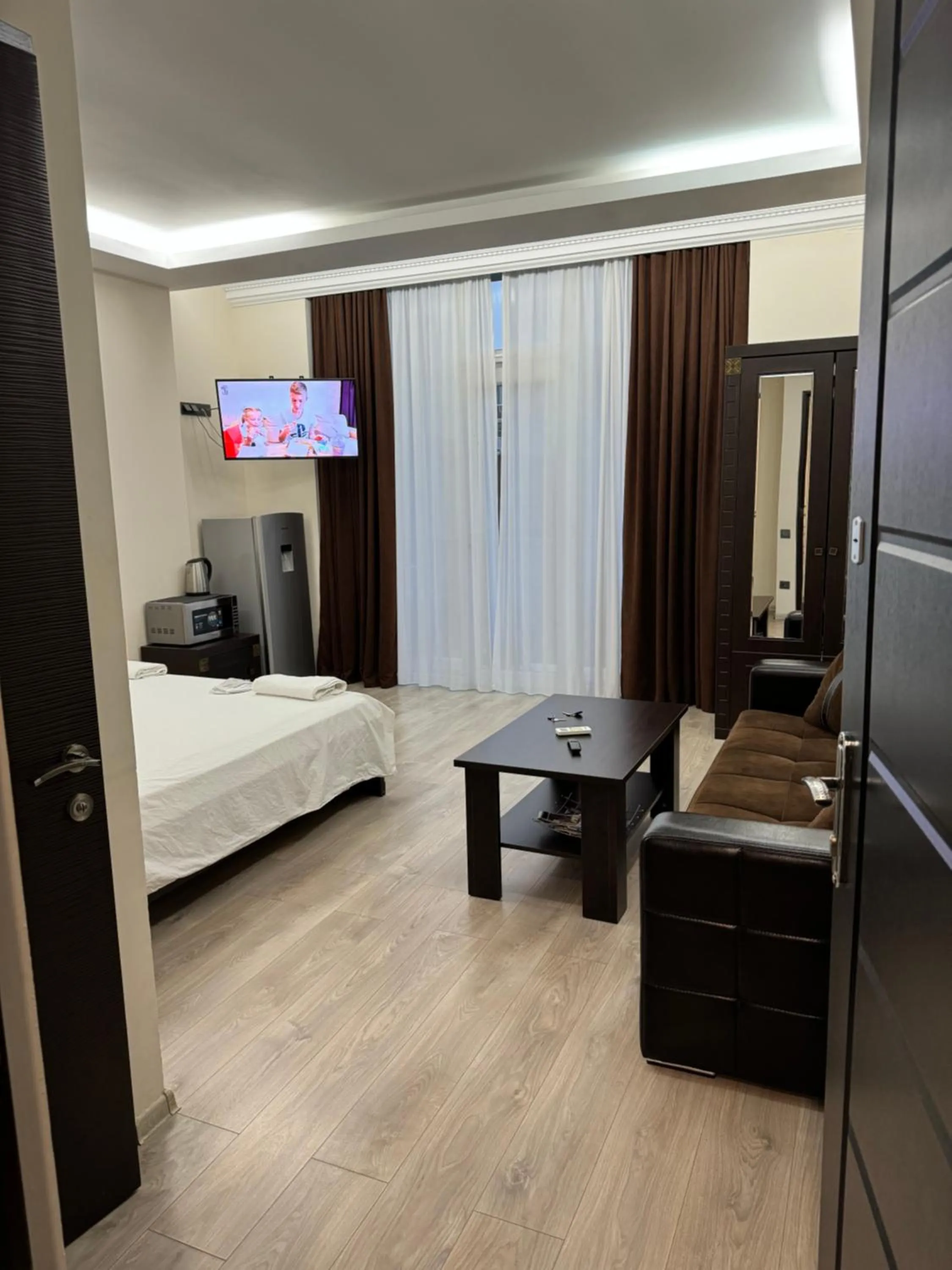 Bed in Iko's Family Apartments