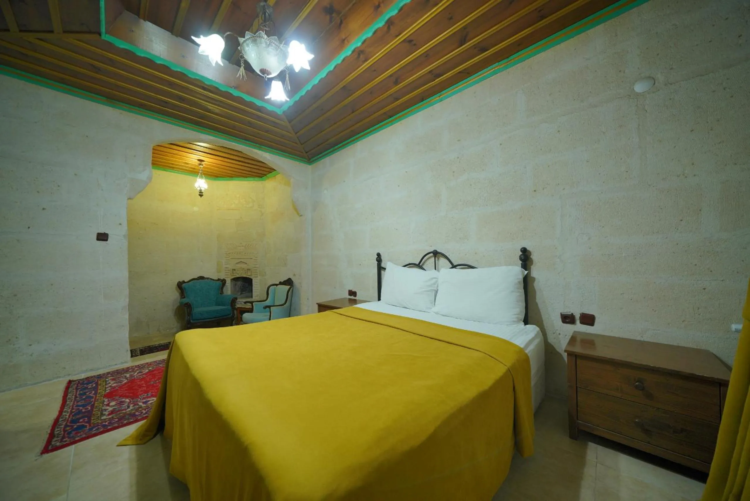 Bed in Holiday Cave Hotel