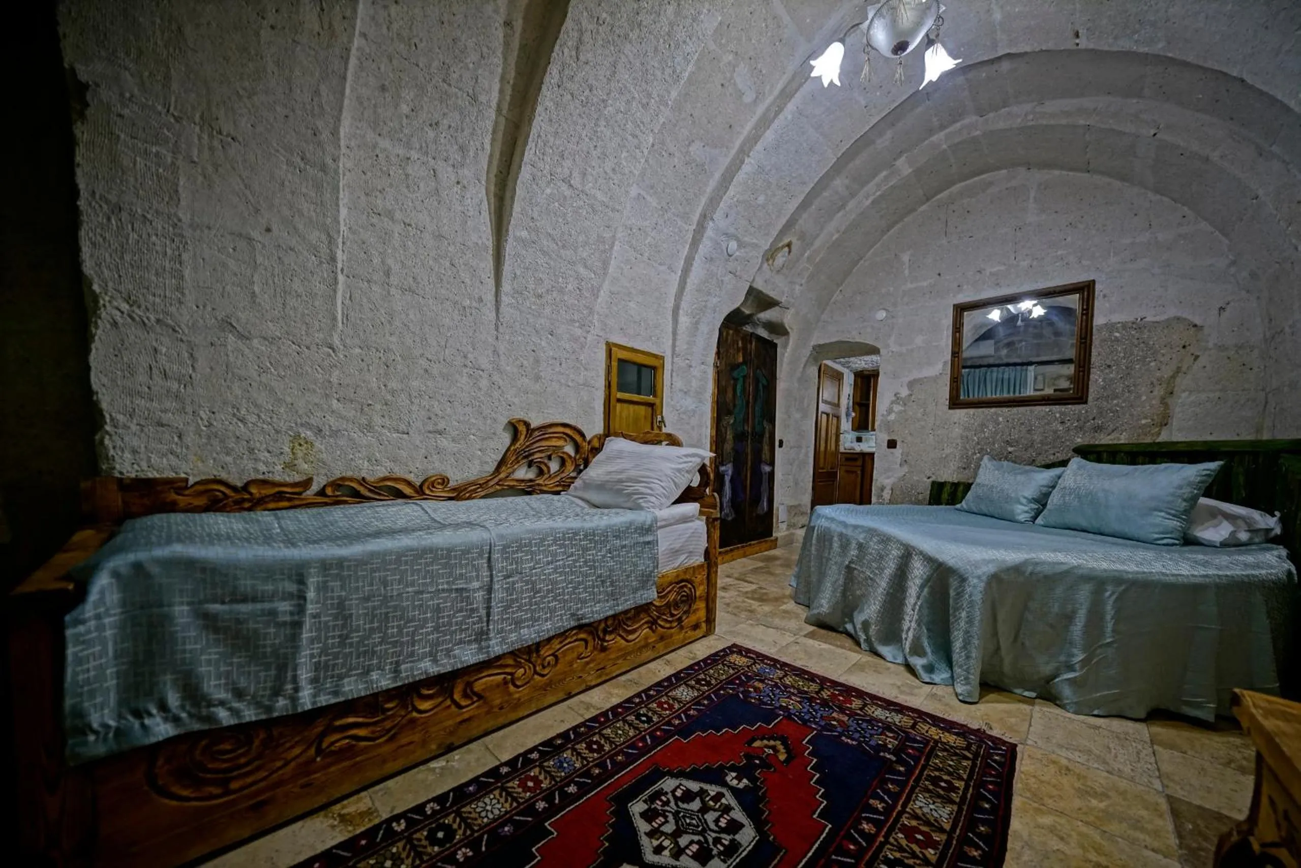 Bed in Holiday Cave Hotel