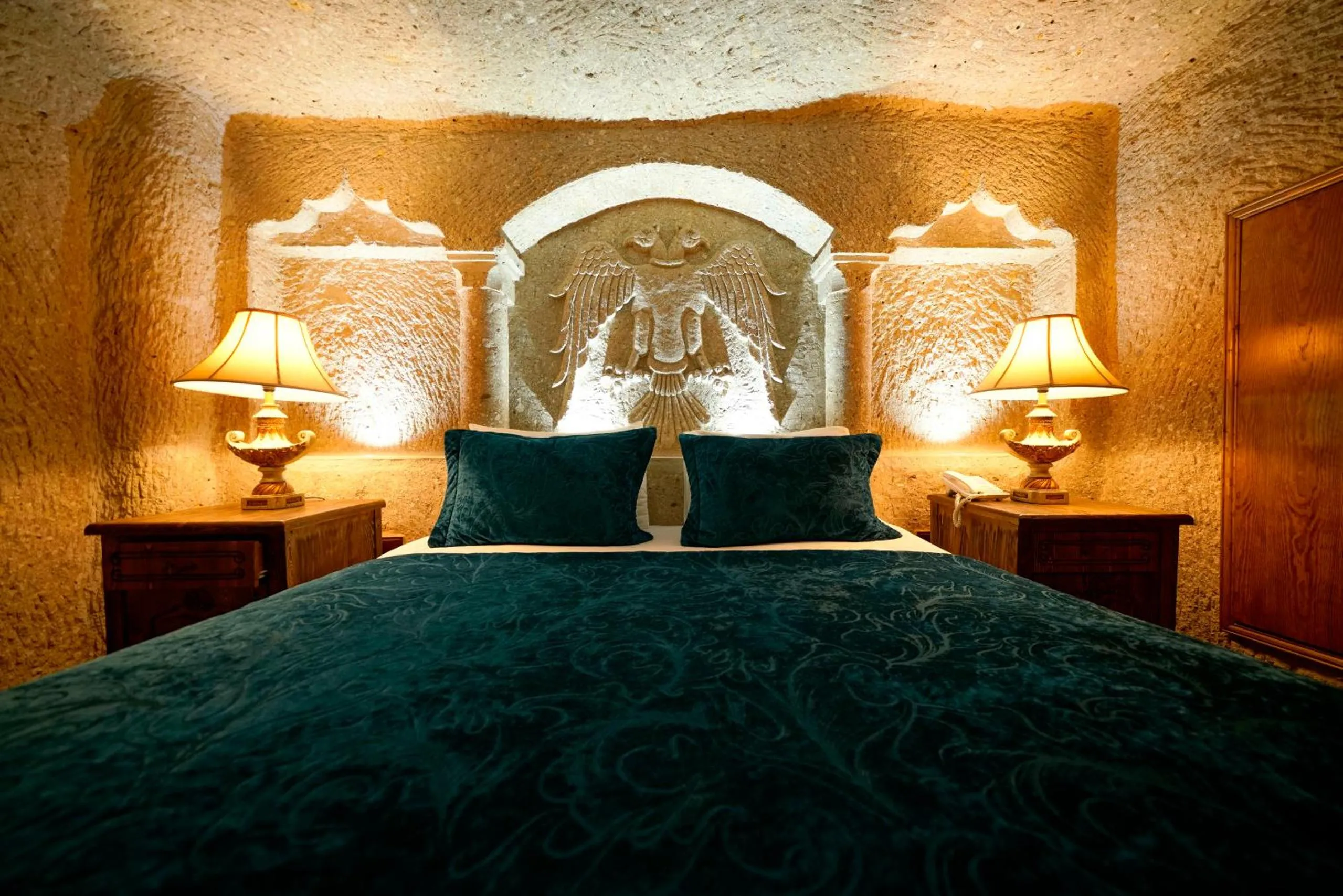 Bed in Holiday Cave Hotel