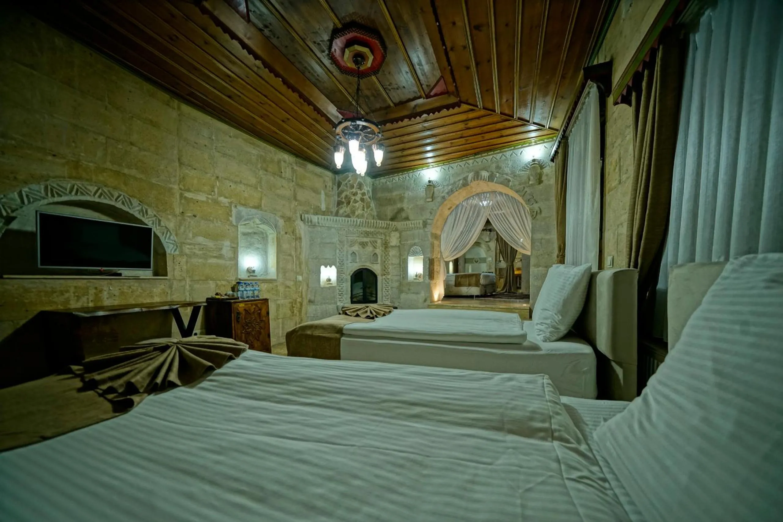 Bed in Holiday Cave Hotel