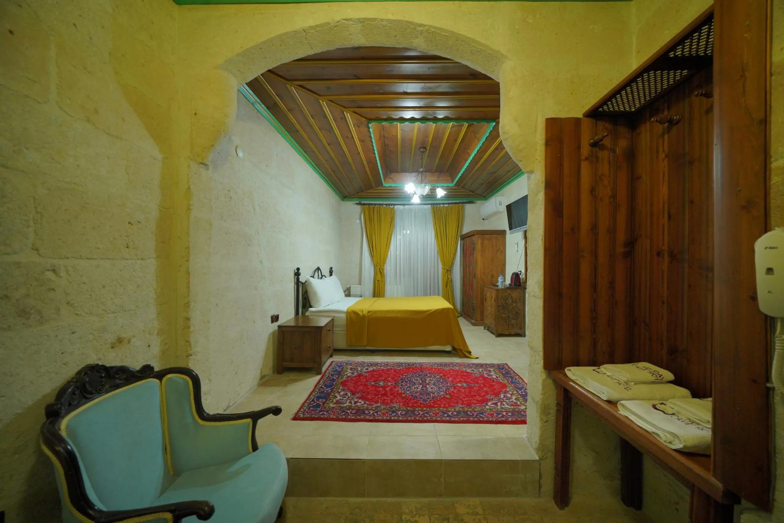 Bed in Holiday Cave Hotel