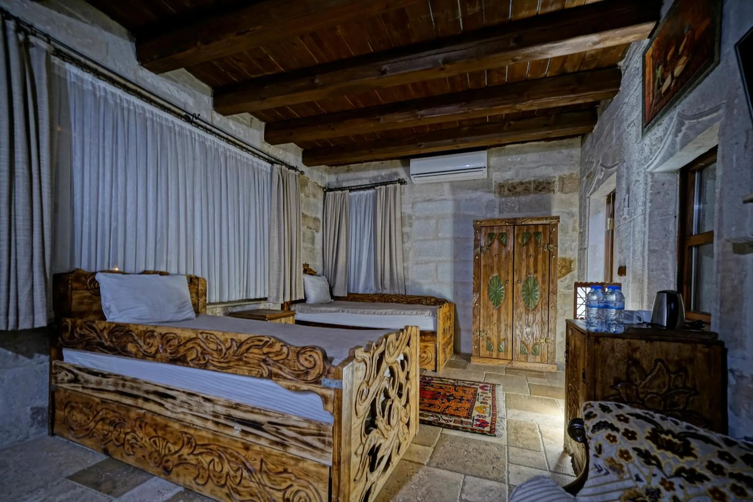 Bed in Holiday Cave Hotel