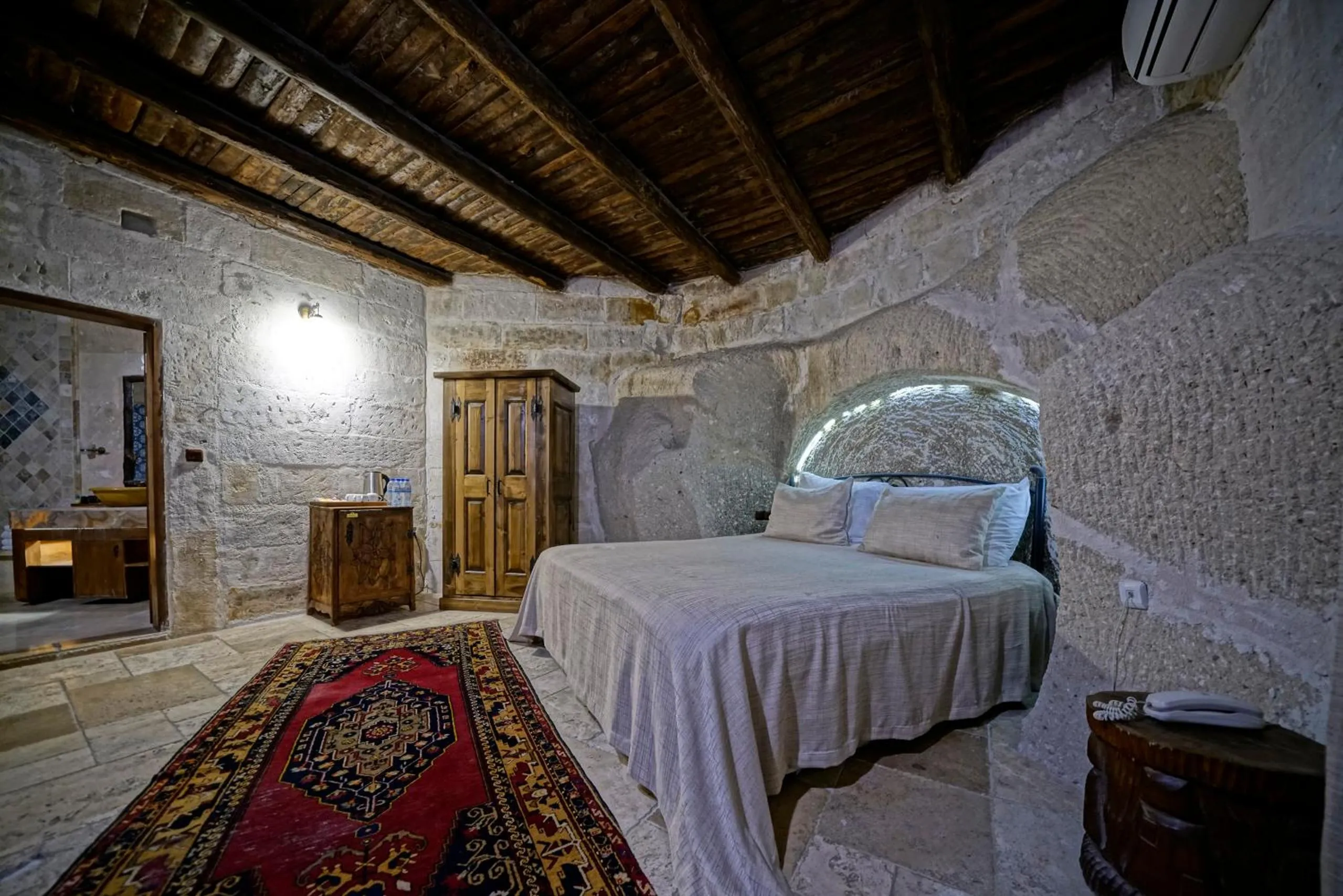 Bed in Holiday Cave Hotel