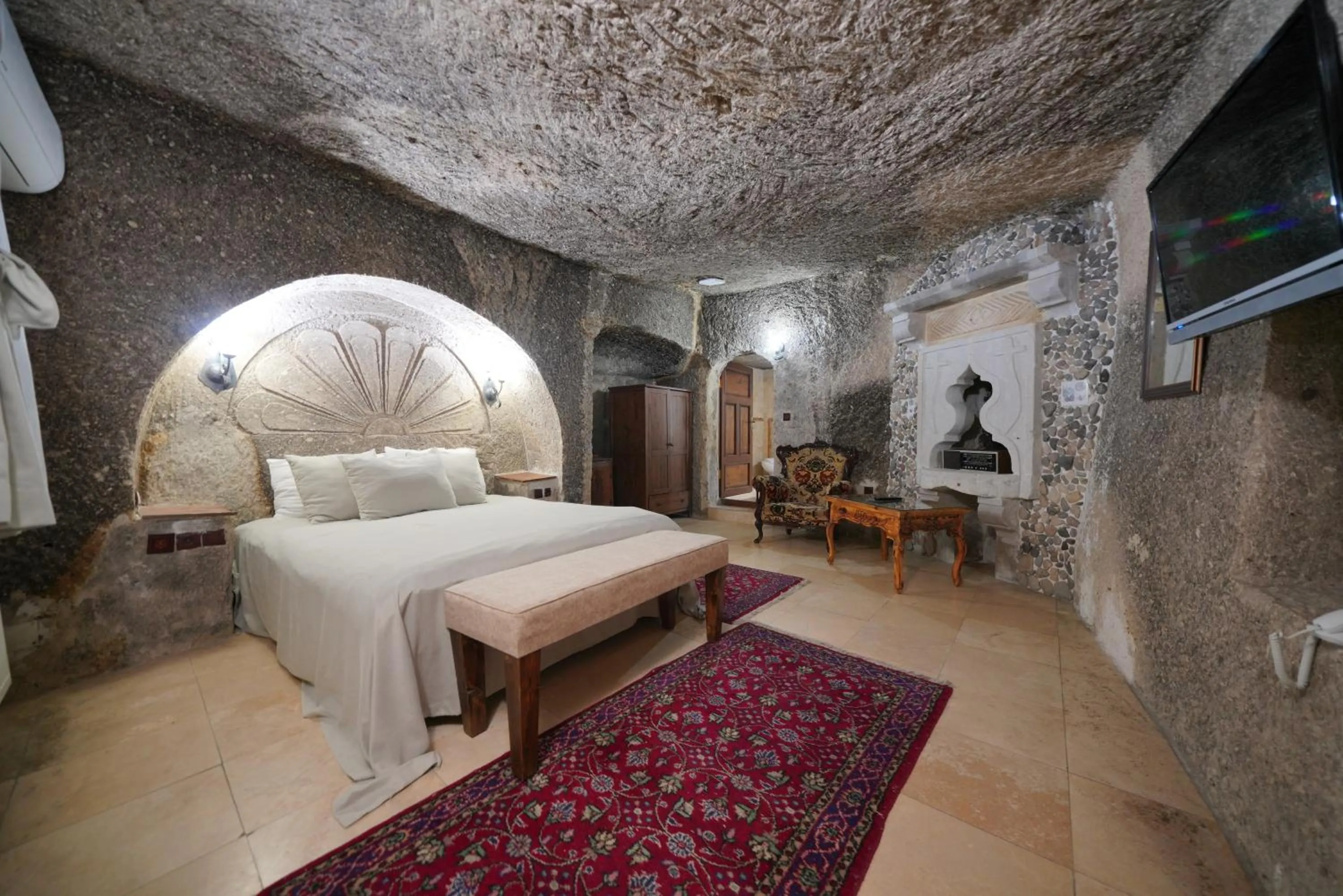 Bed in Holiday Cave Hotel