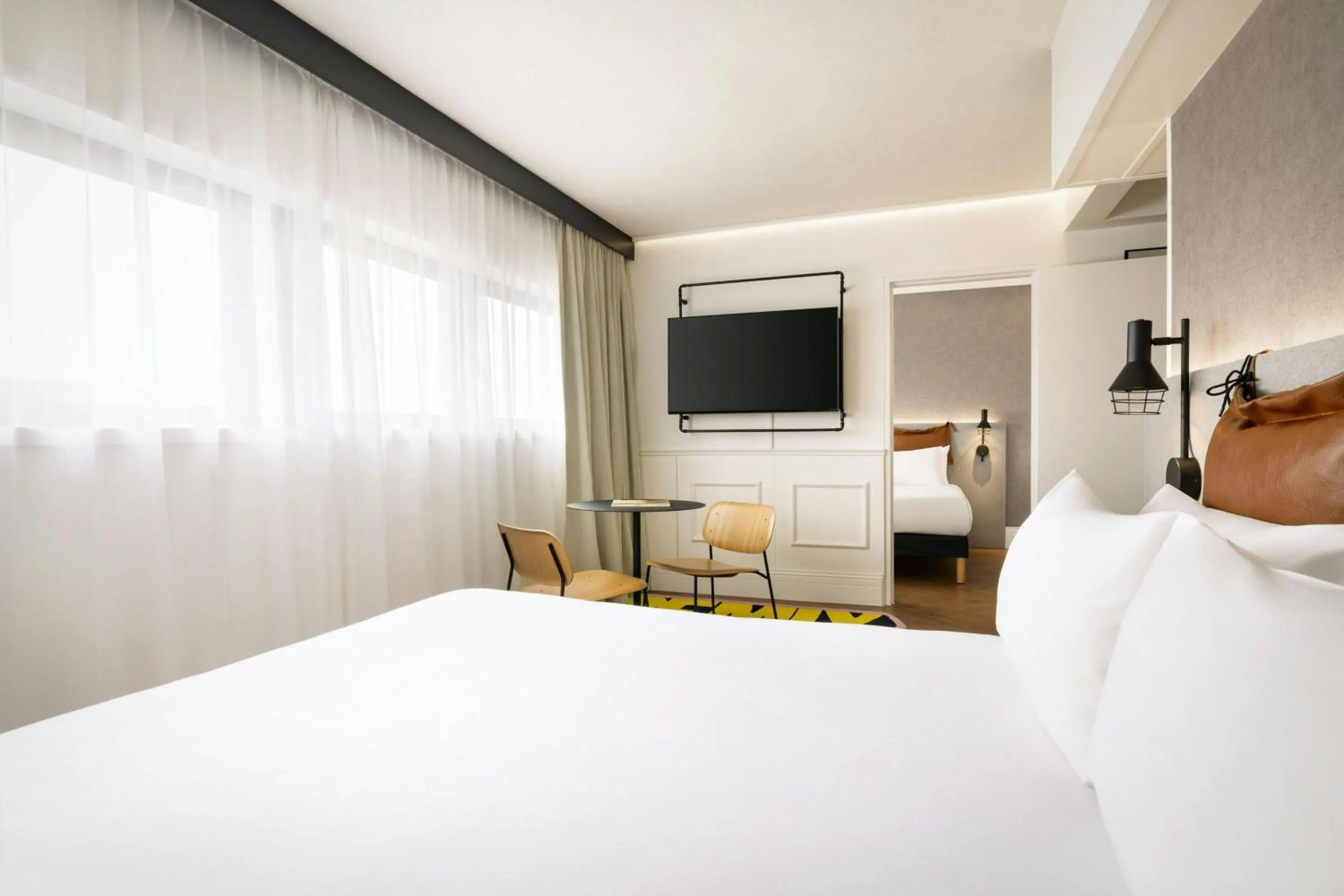 Photo of the whole room, Bed in Moxy Paris La Villette