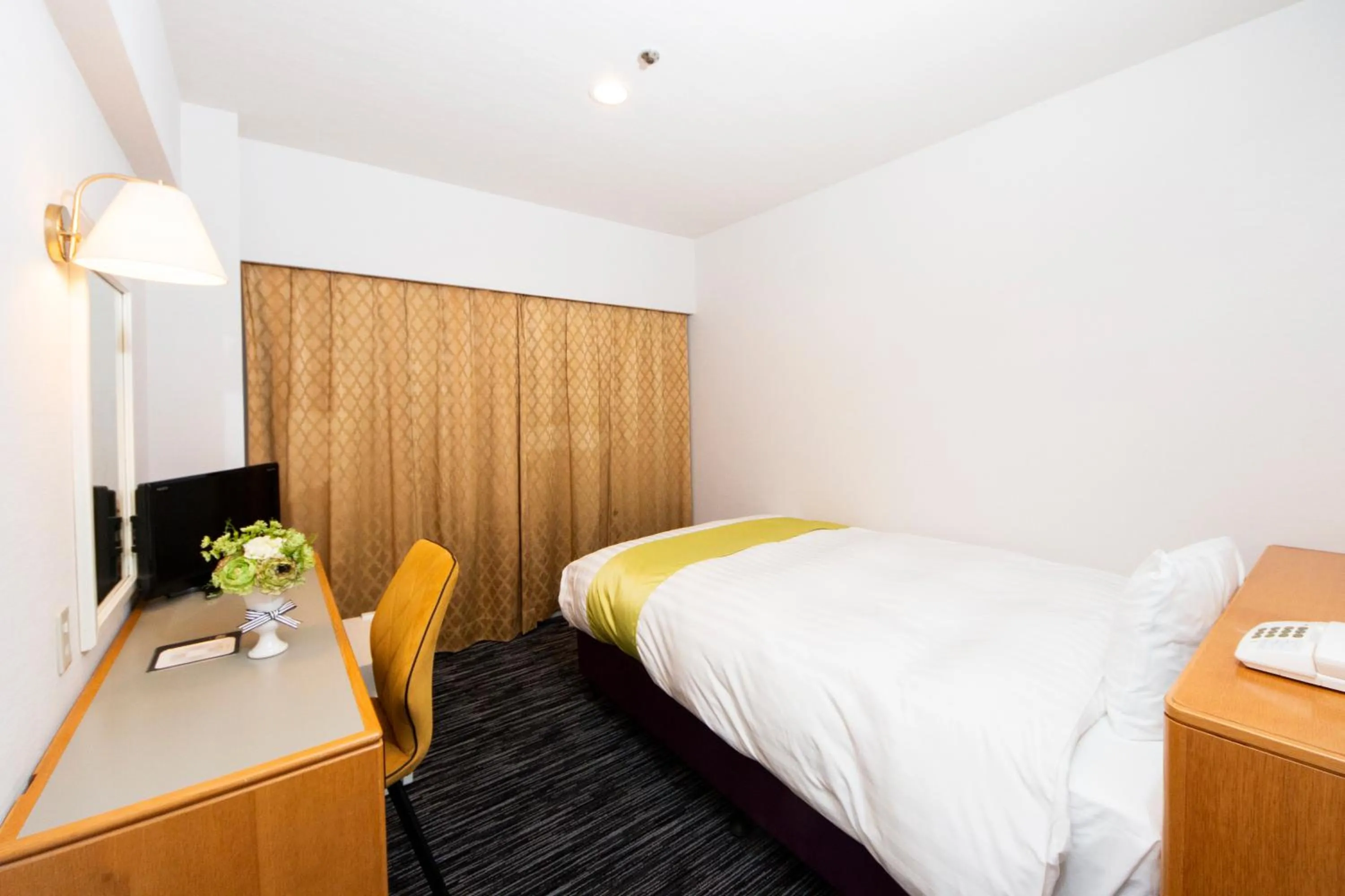 Bed in Hotel Montoview Yonezawa