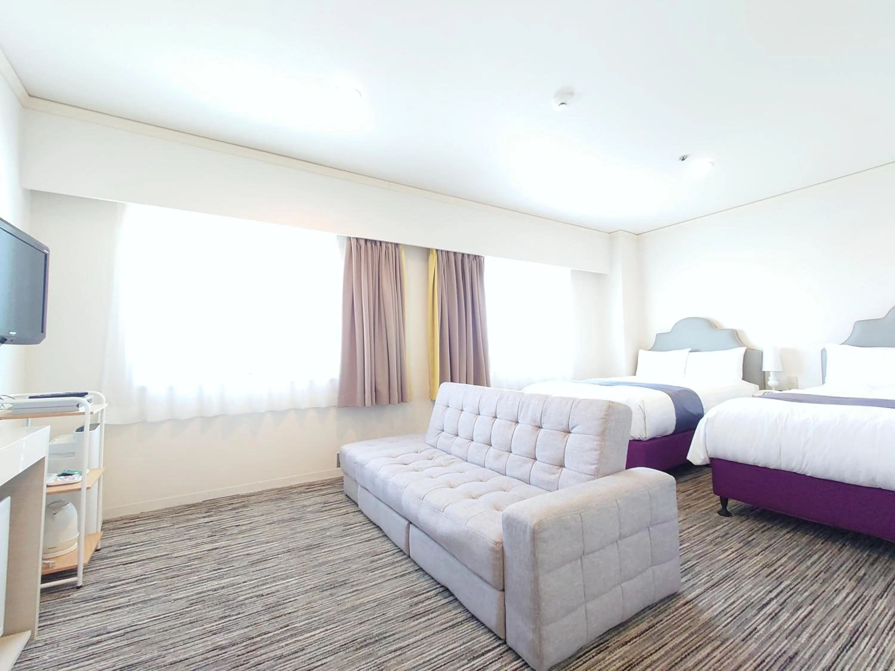 Communal lounge/ TV room, Bed in Hotel Montoview Yonezawa