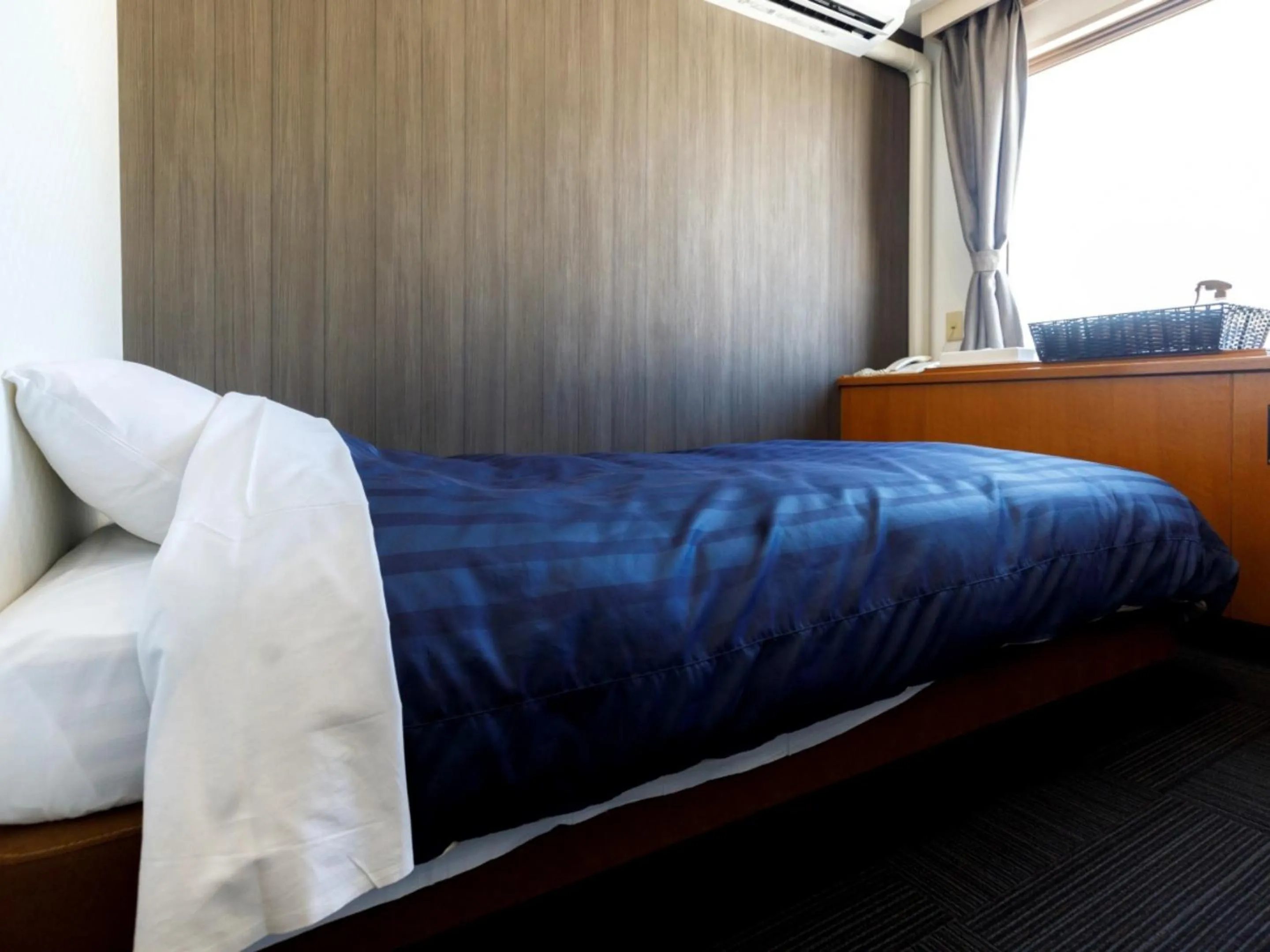 Bed in Miyazaki Lions Hotel