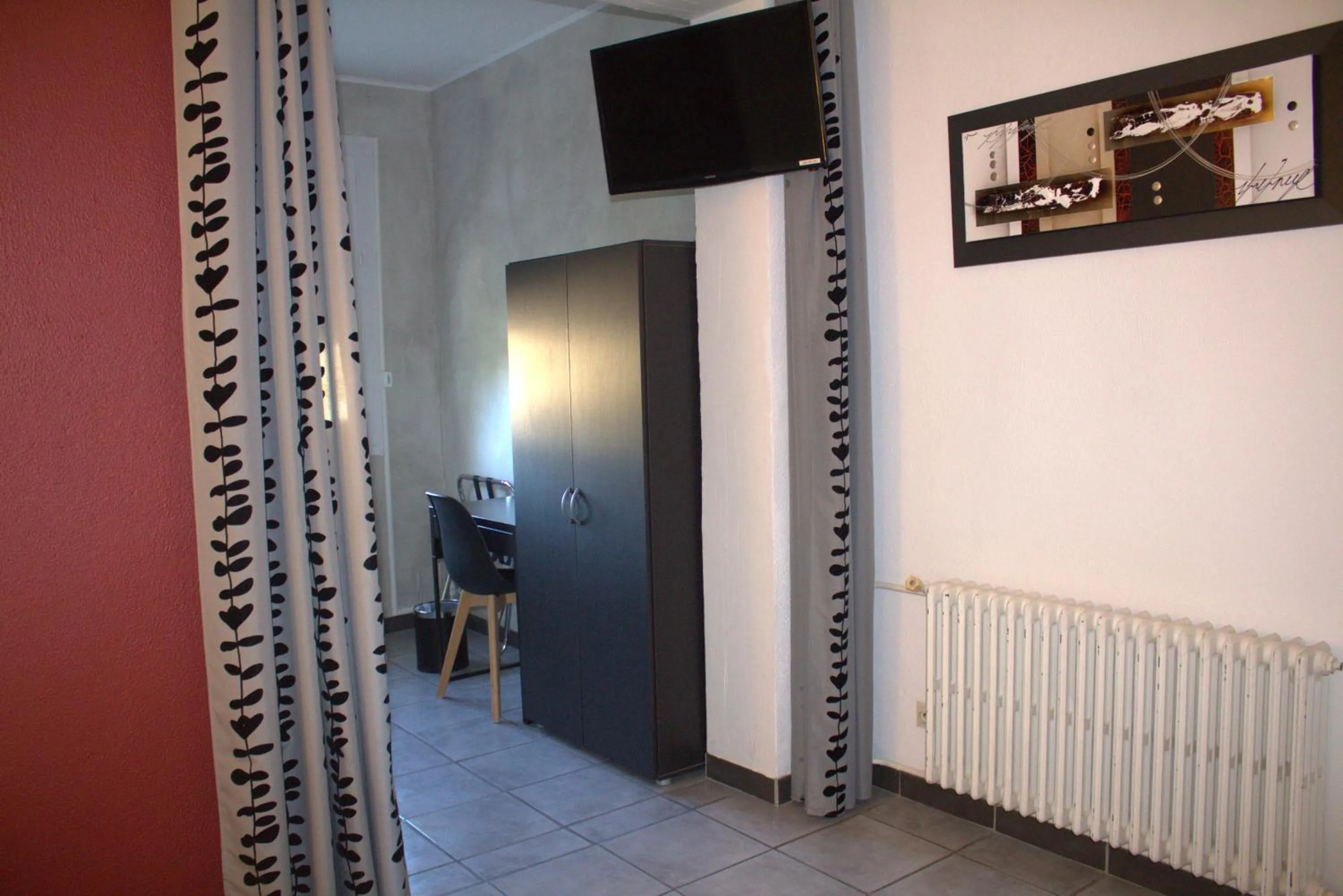 Seating area in Logis Hôtel Le Clement V