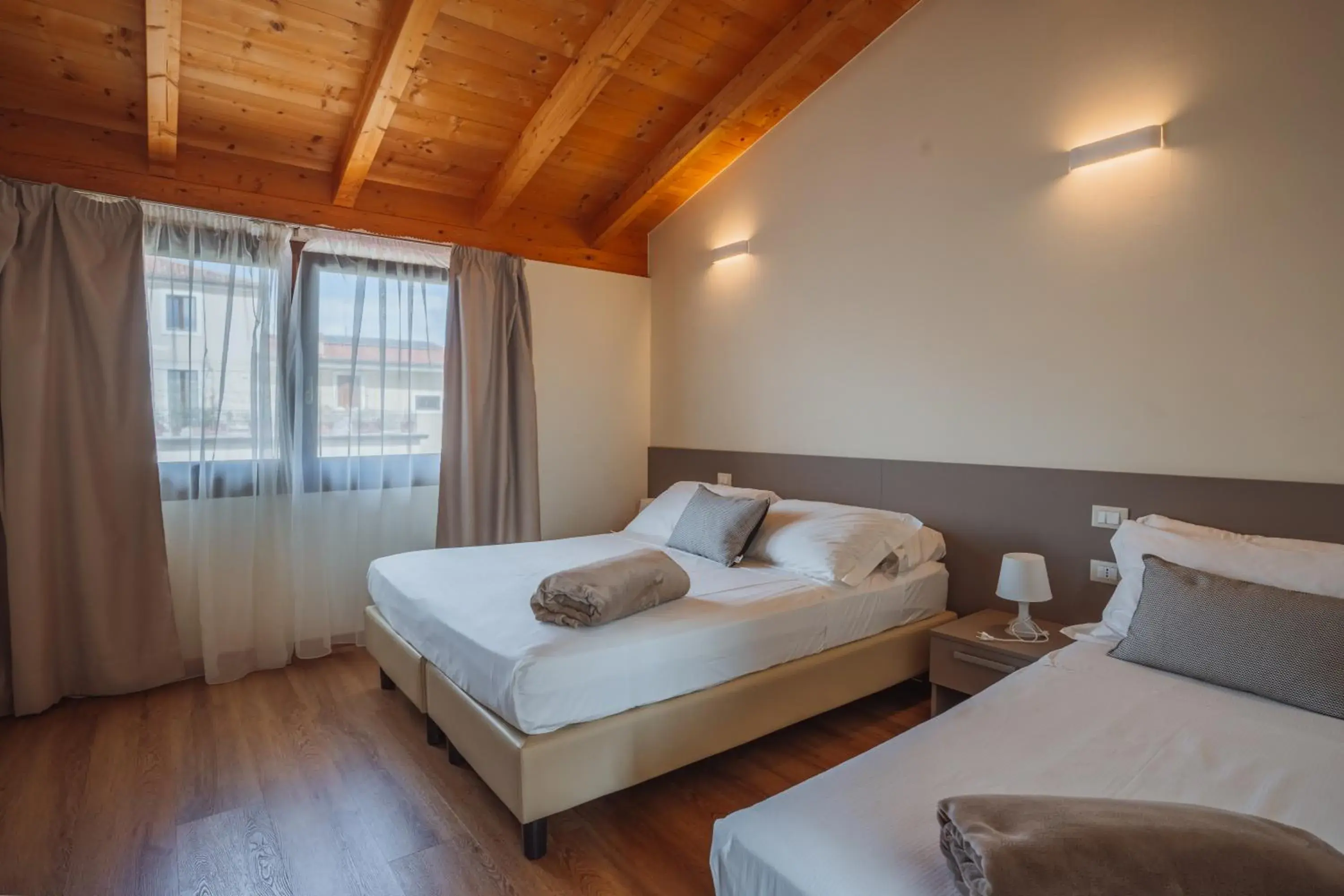 Superior Triple Room with Garden View in Garda Relais Superior Triple Room with Garden View in Garda Relais