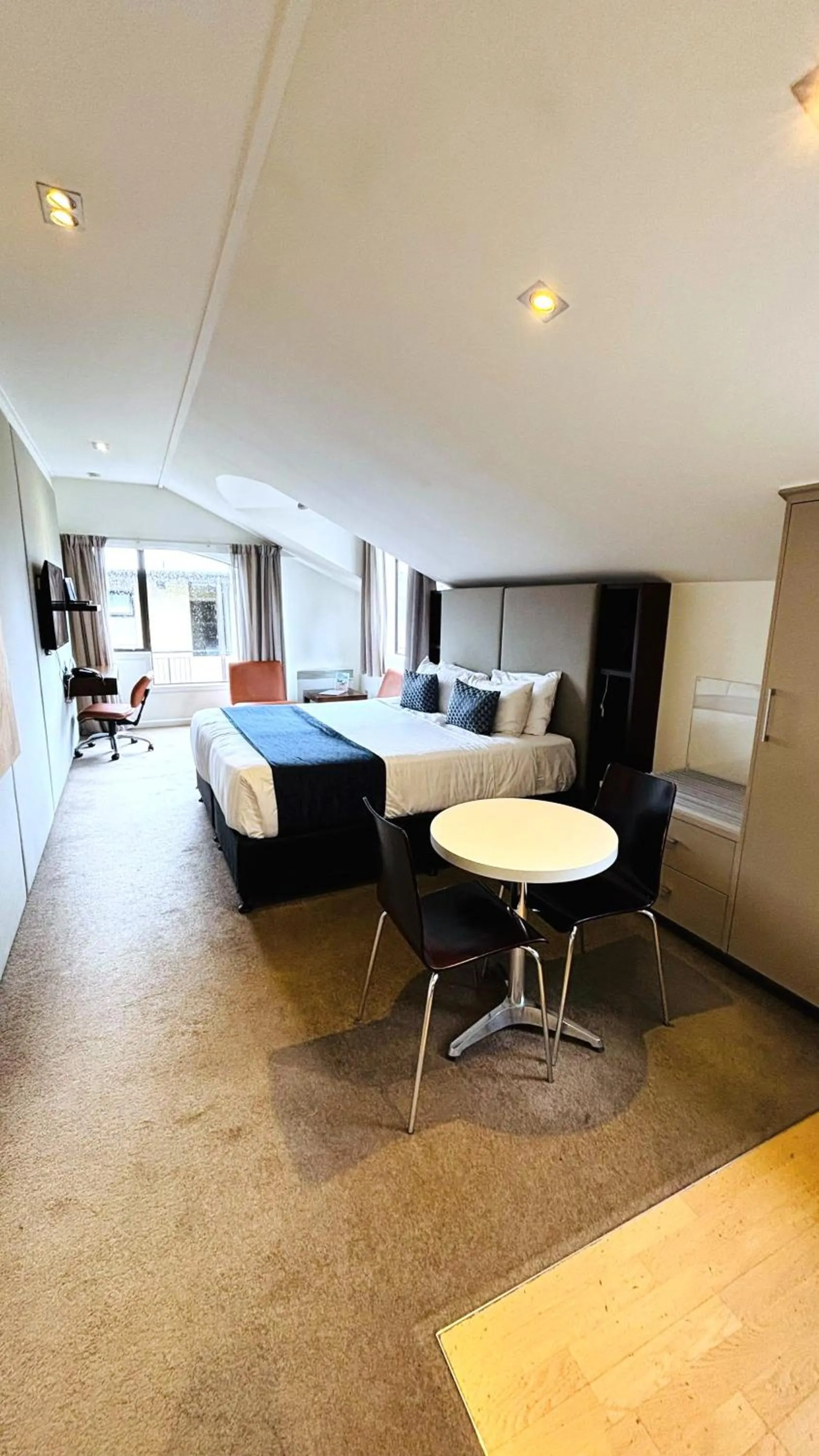 Bedroom in Garden Court Suites & Apartments