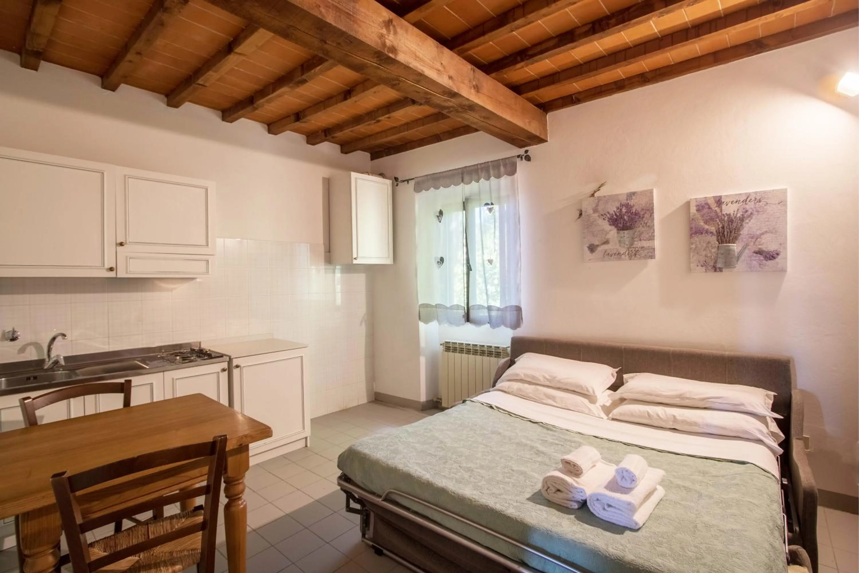 Kitchen or kitchenette, Bed in Residence Mugello Resort
