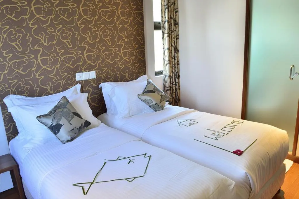 Bed in Turquoise Residence by UI