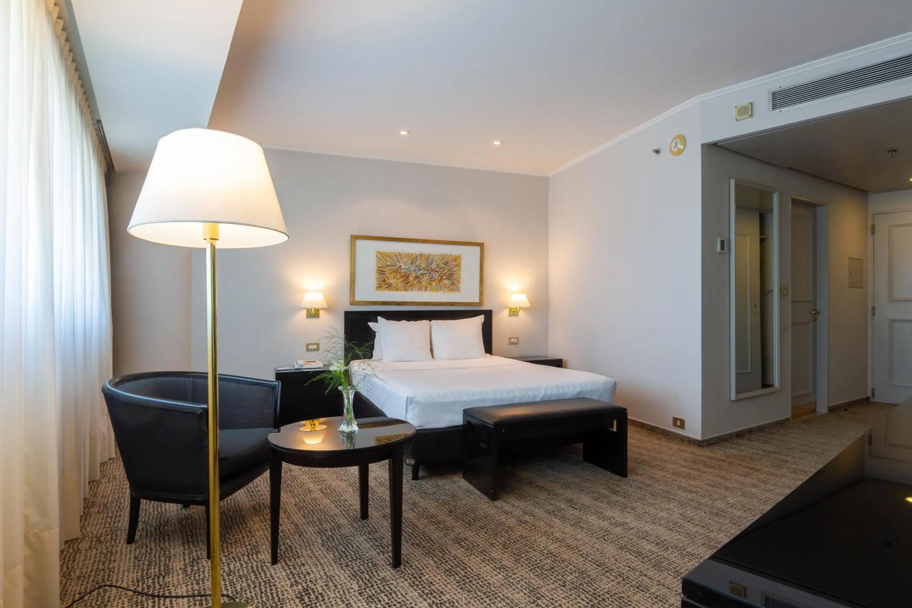 Bed in Quinto Centenario Hotel