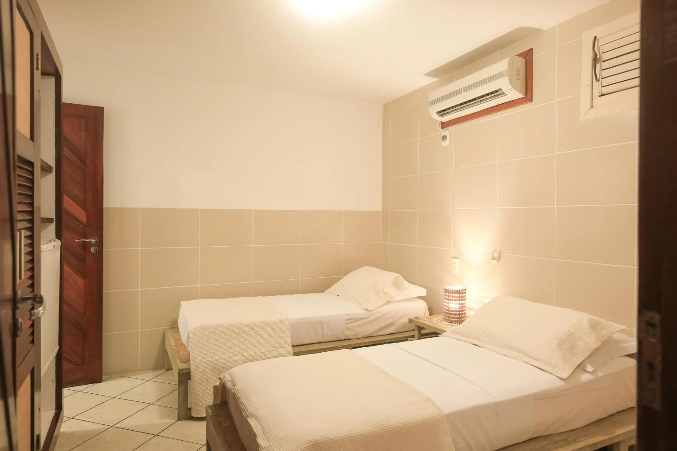 Bed in Pousada Bicho Preguiça