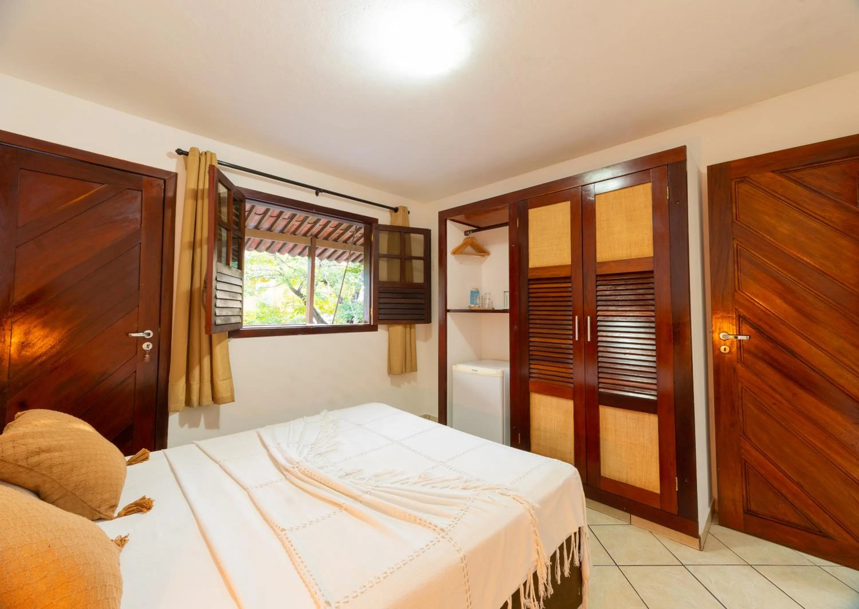 Bed in Pousada Bicho Preguiça