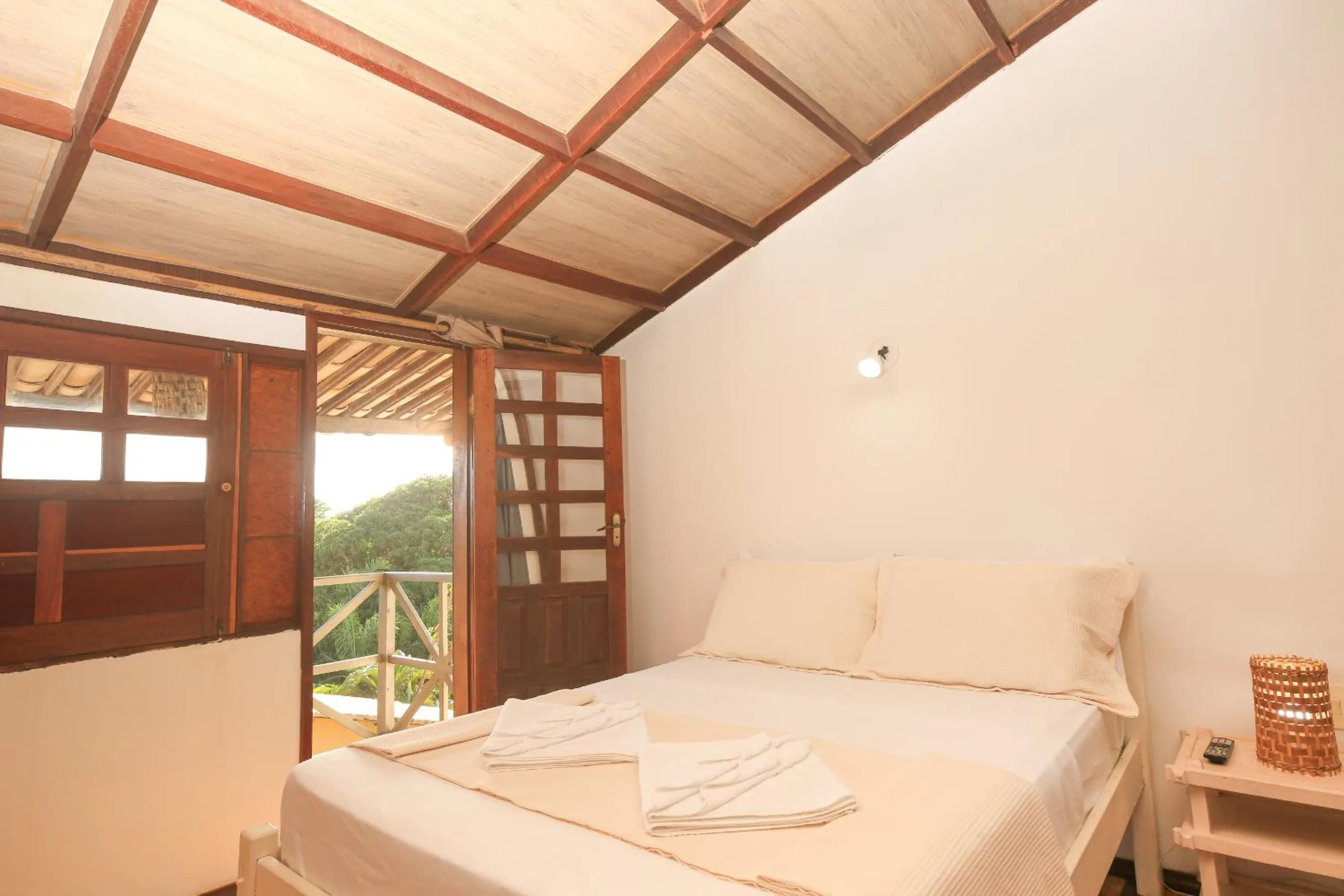 Bed in Pousada Bicho Preguiça