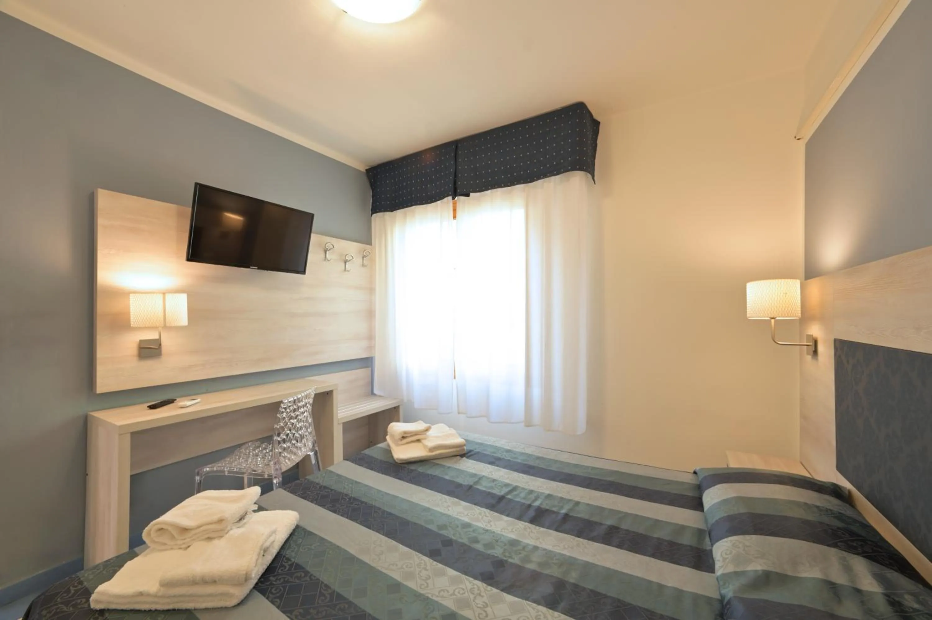 Bed in Hotel Delfino