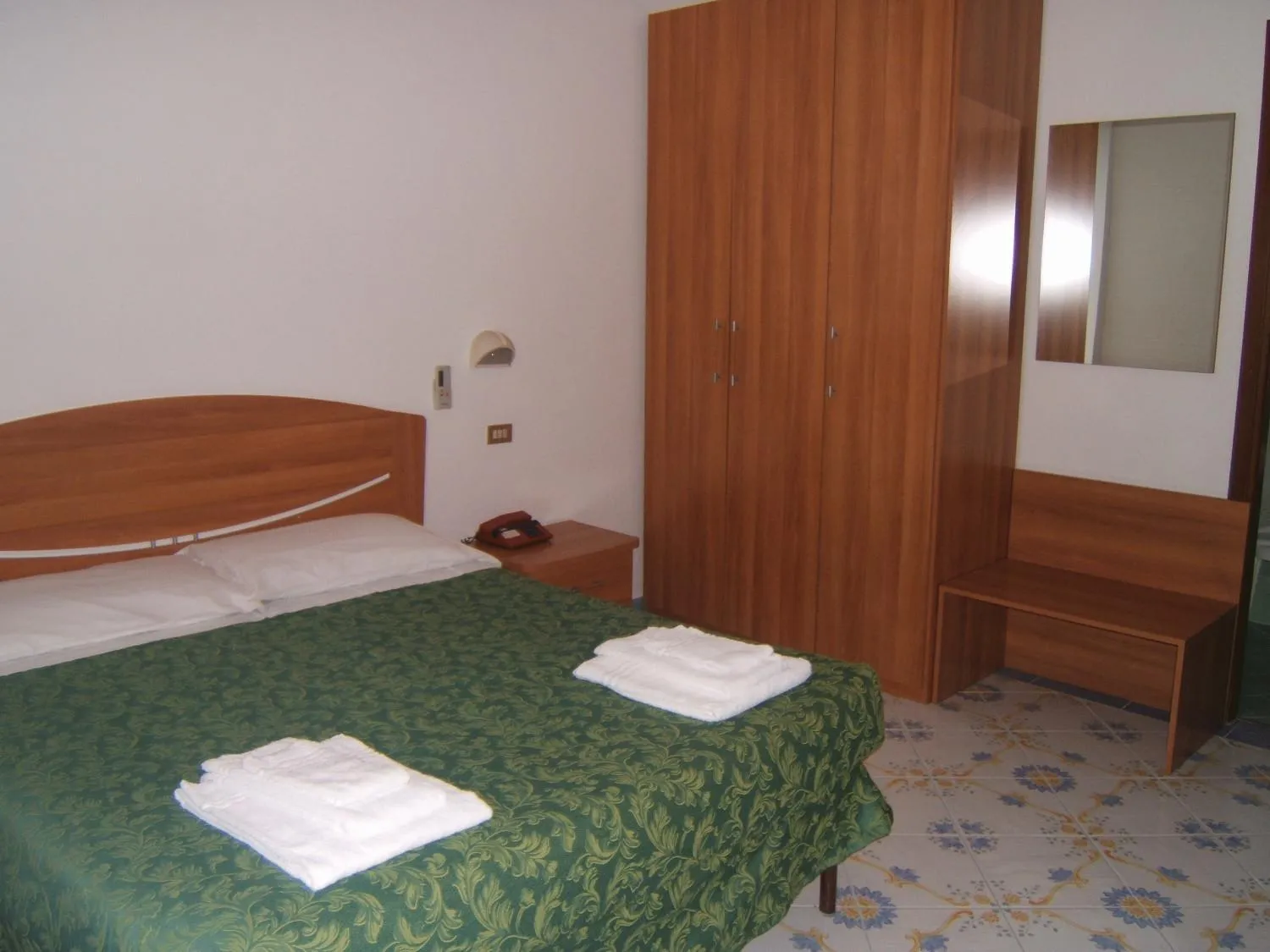 Bed in Hotel Delfino