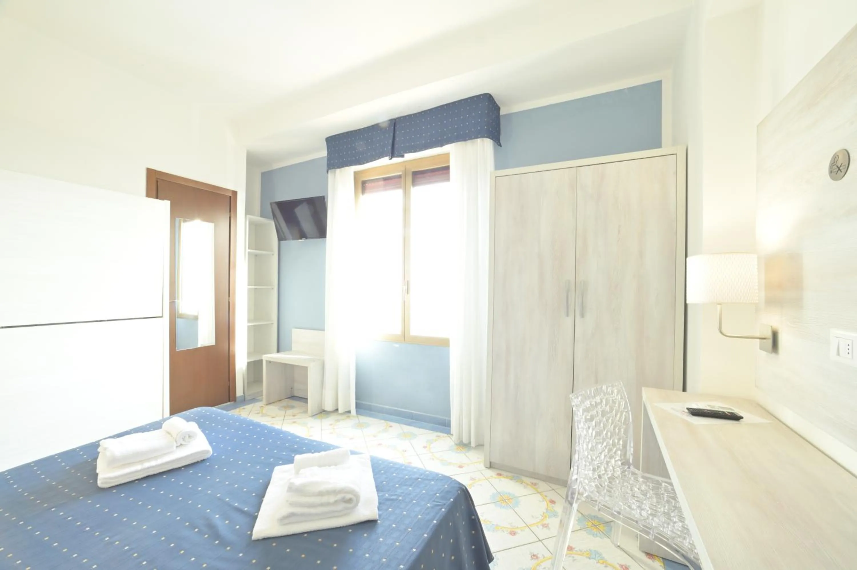 Bed in Hotel Delfino