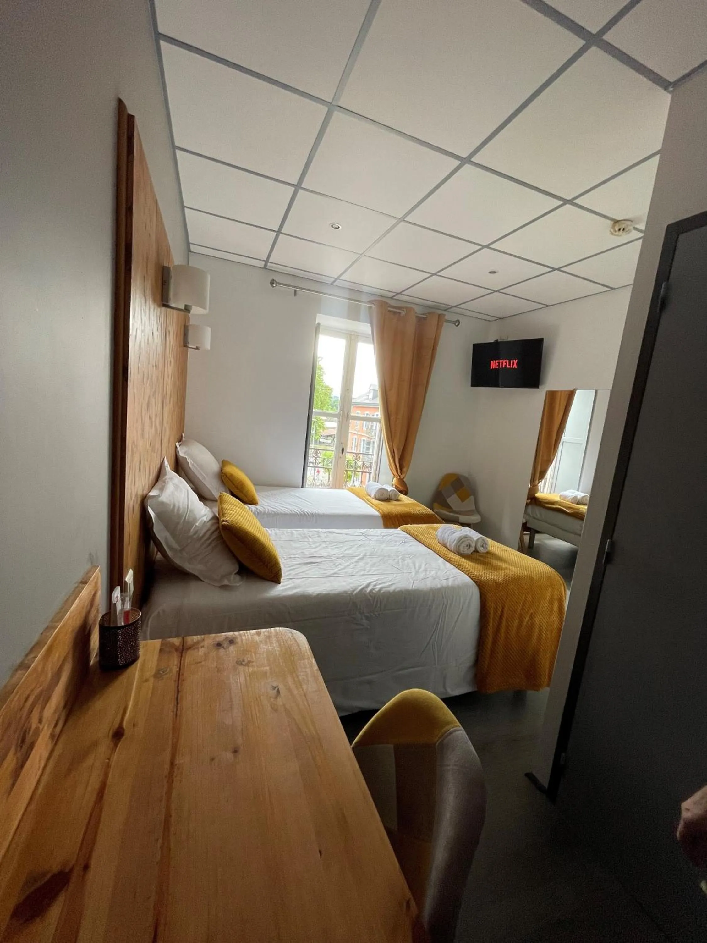 Bed in Le Central Hôtel-Bar