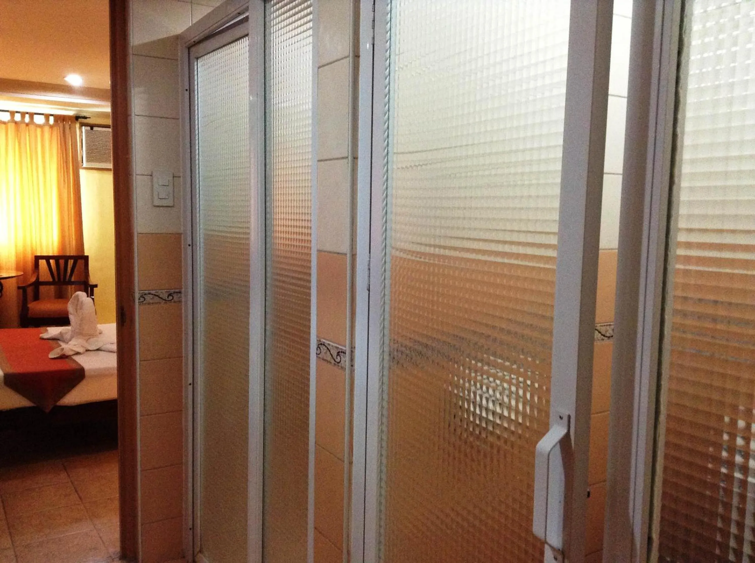 Bathroom, Bed in Crown Regency Residences Davao