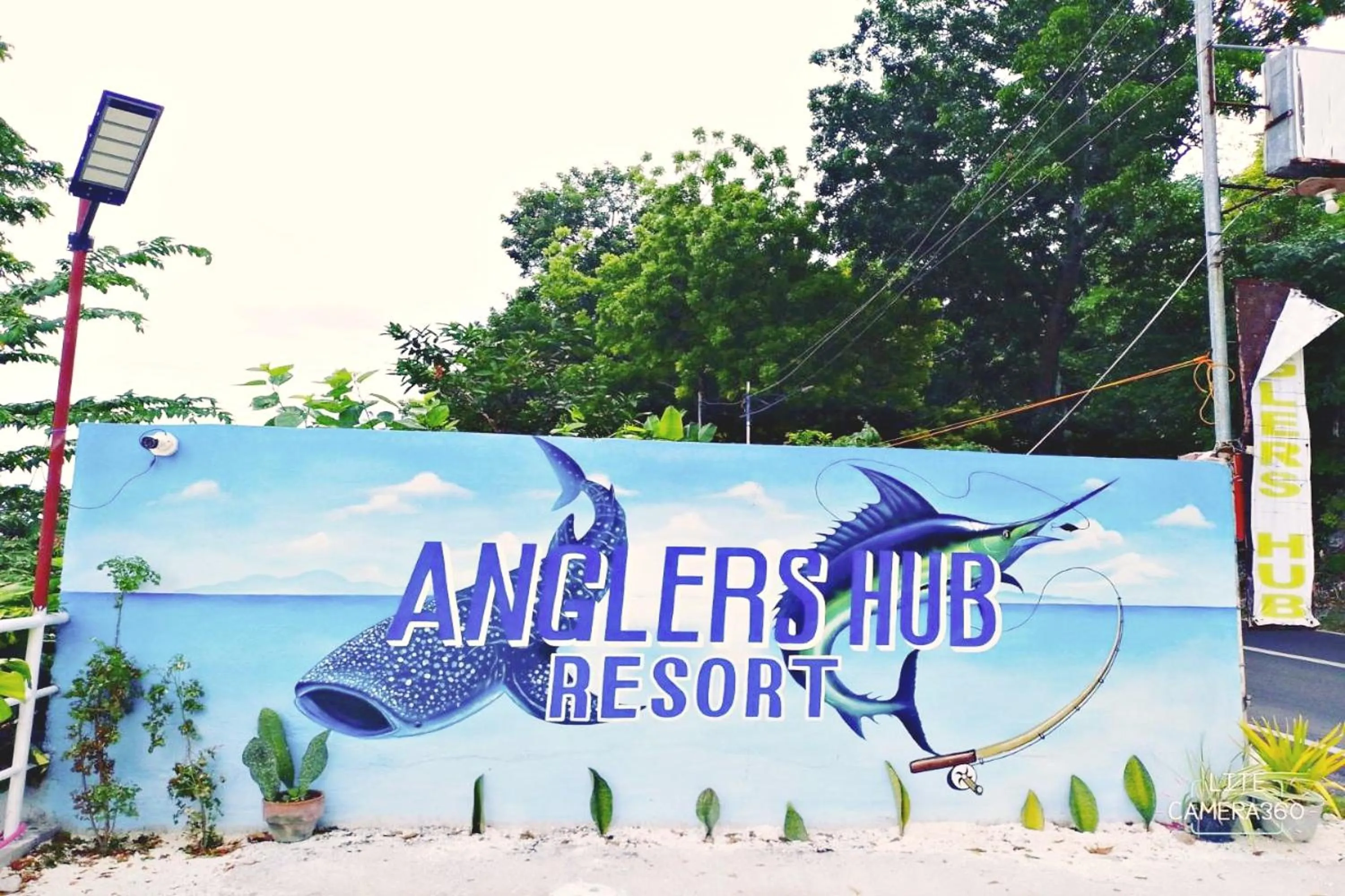 Property logo or sign in Angler's Hub & Resort Oslob