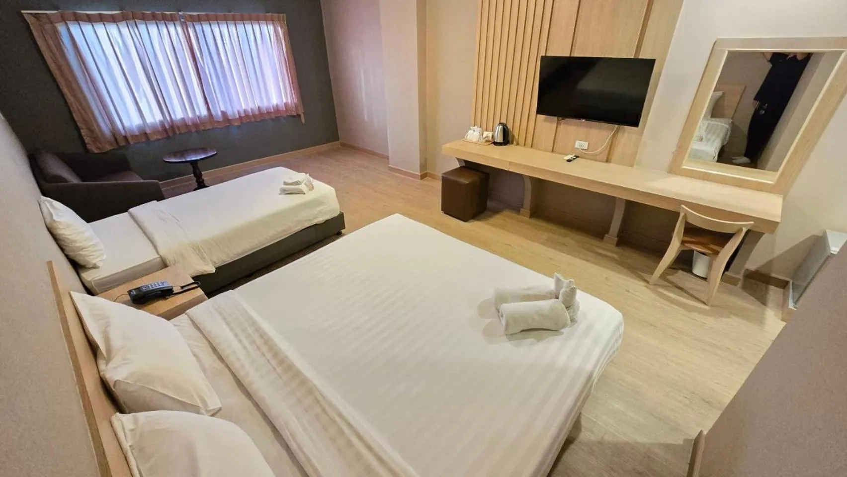 Bed in Grand Tara Garden Thai Hotel