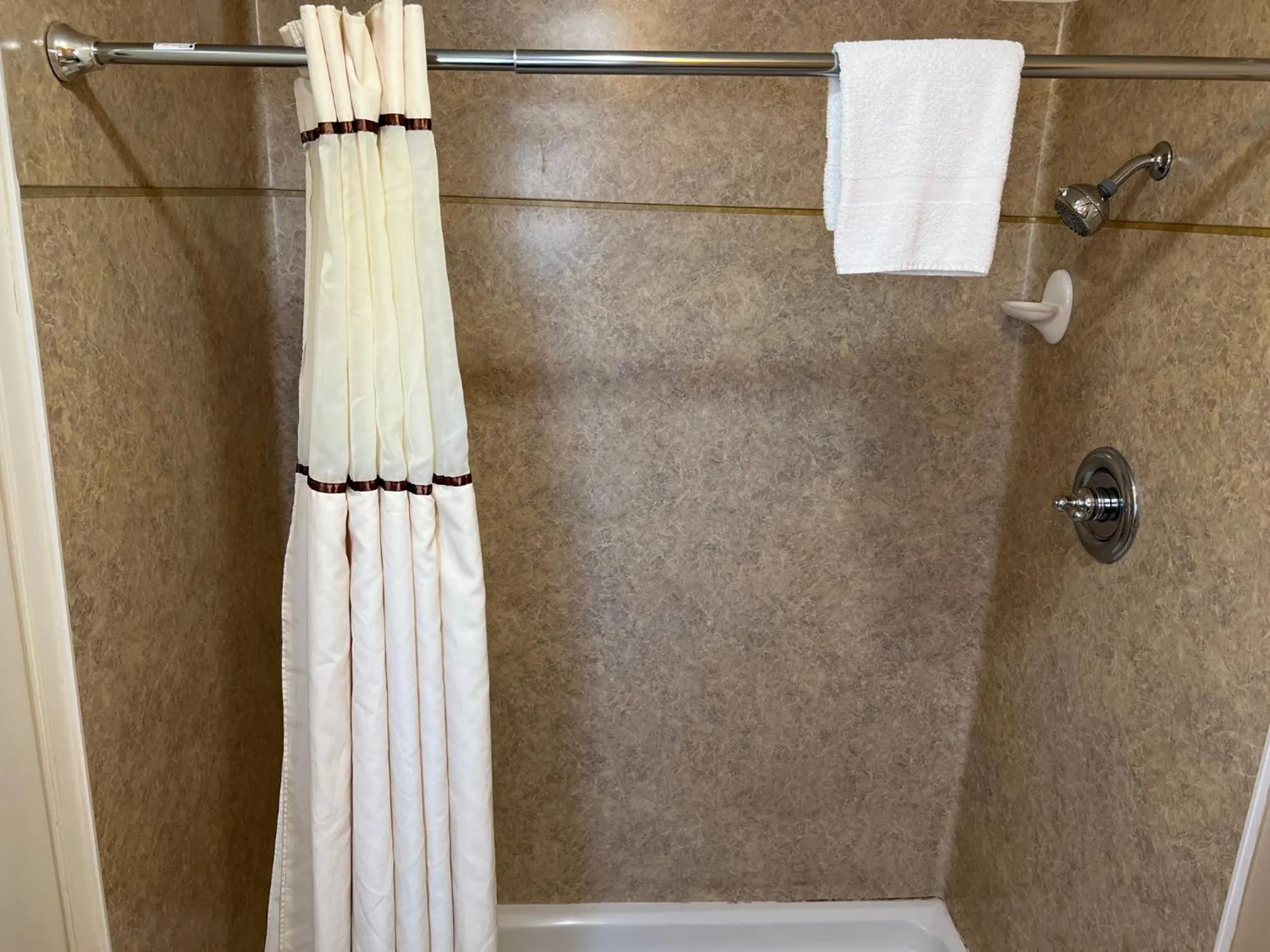 Shower in Lamp Liter Inn Visalia, an Ascend Collection Hotel