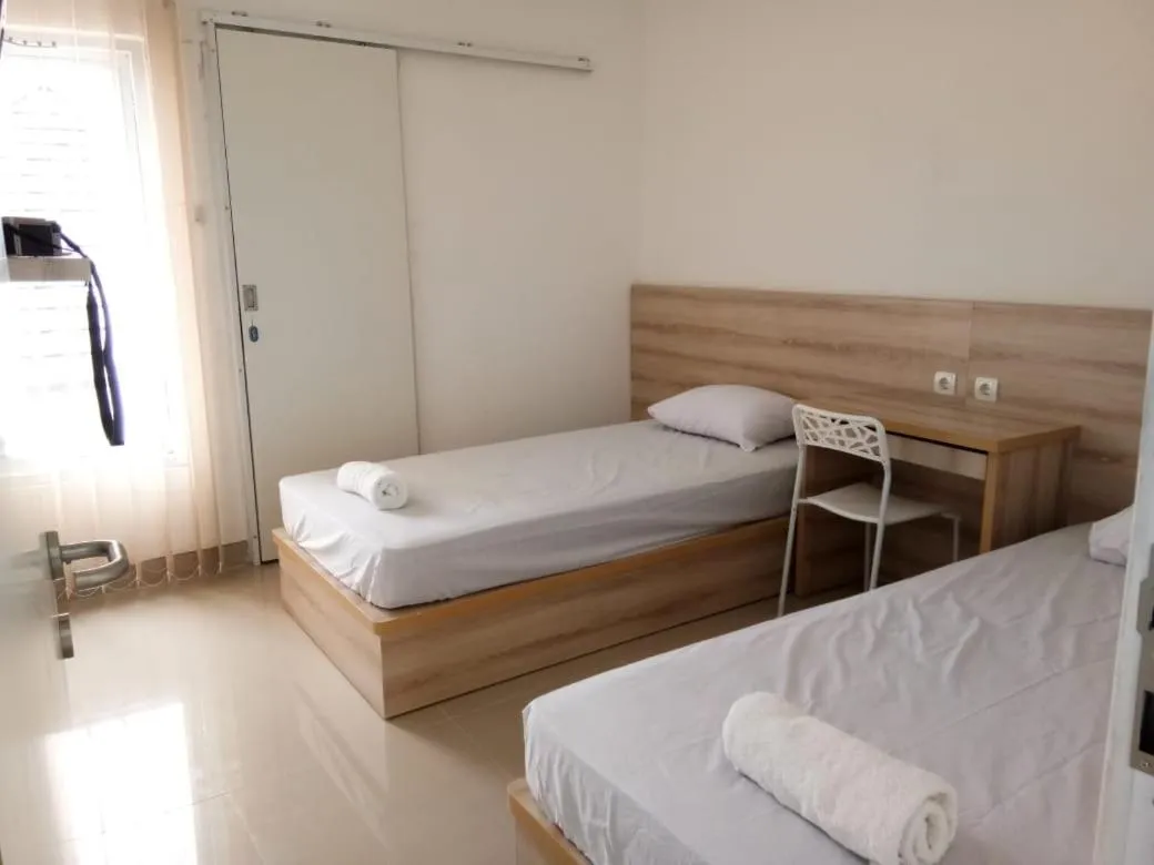 Bed in Wika Bali Beach House