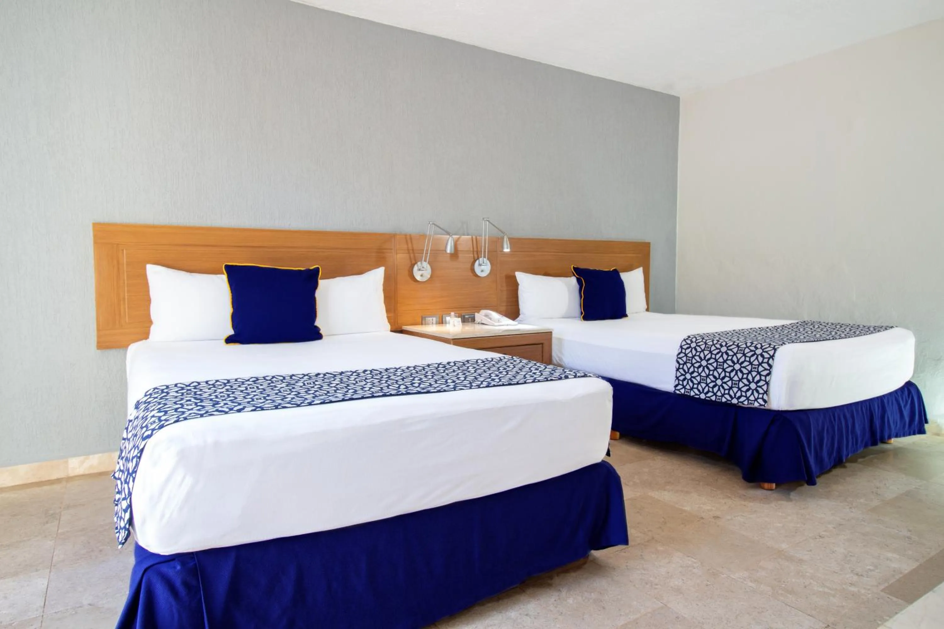 Bed in Plaza Pelicanos Club Beach Resort All Inclusive