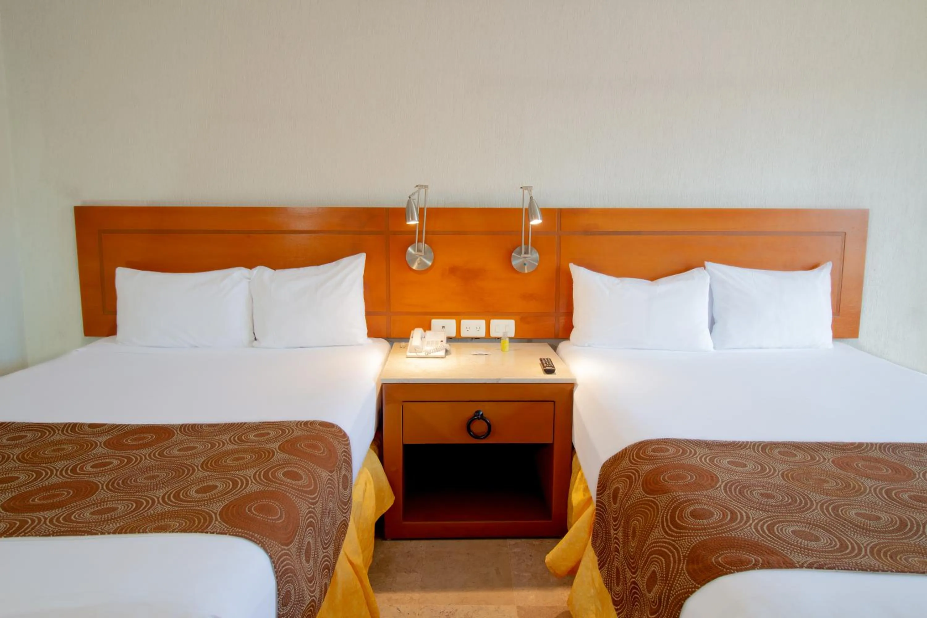 Bed in Plaza Pelicanos Club Beach Resort All Inclusive