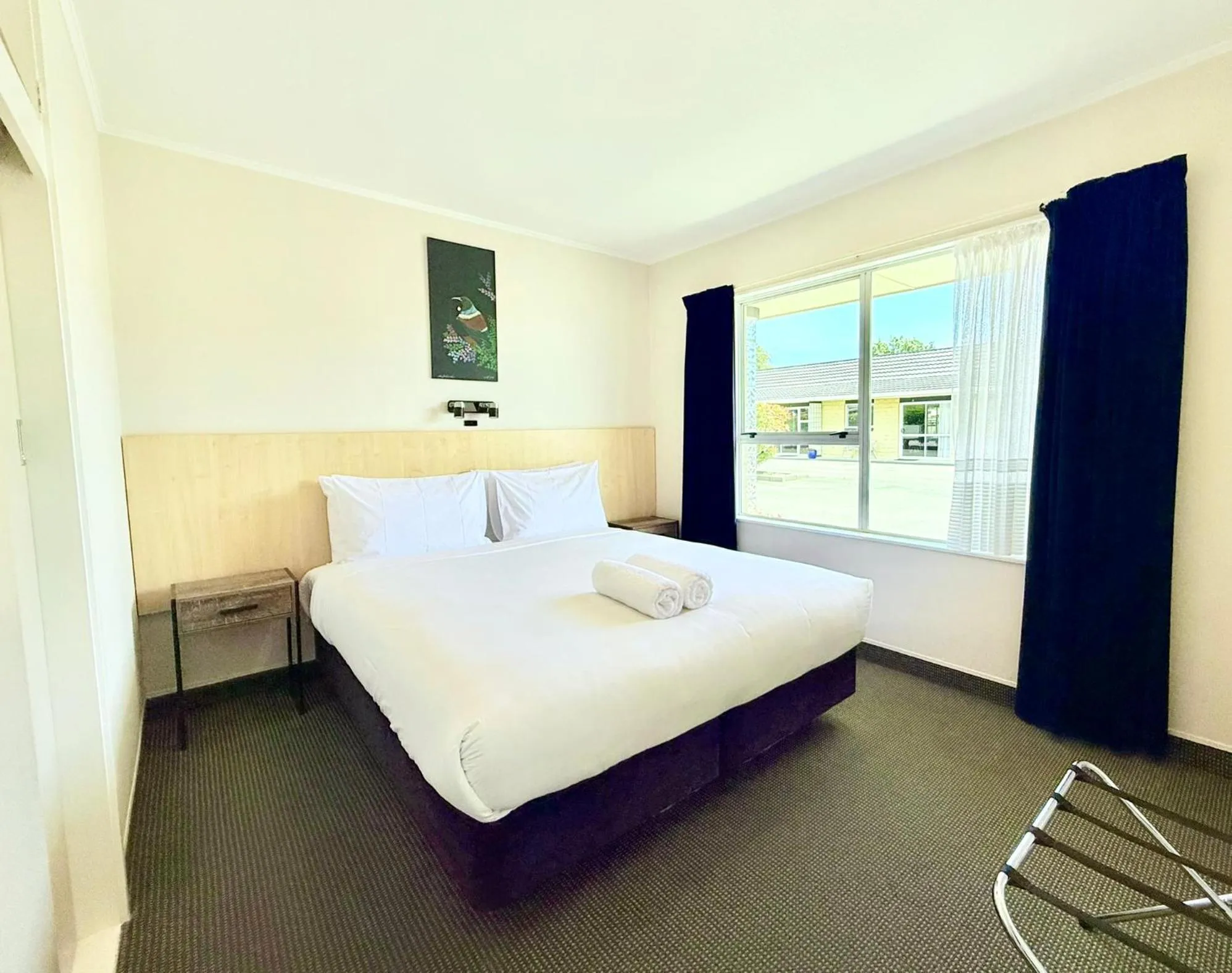 Bed in ASURE Fountain Resort Motel