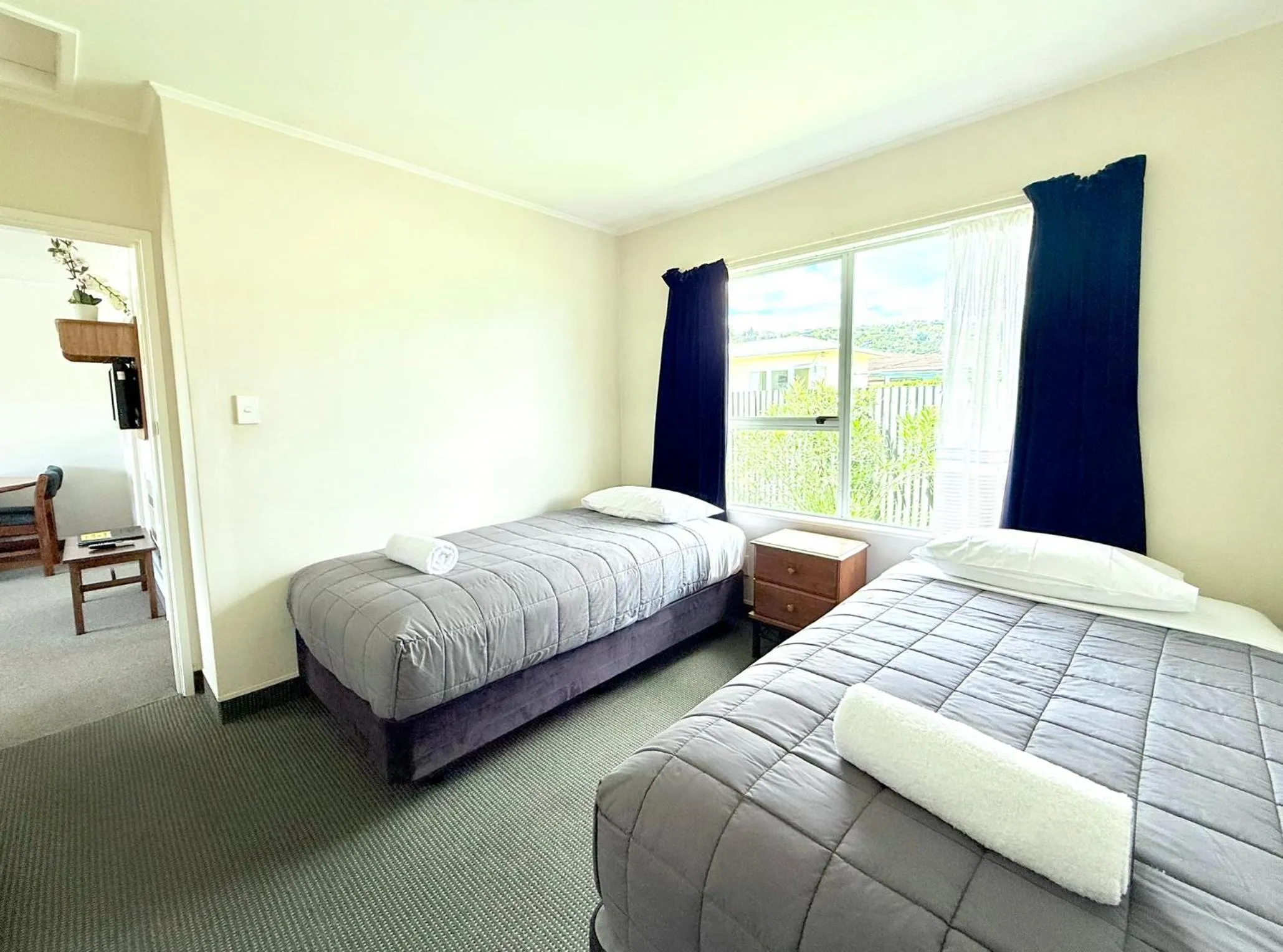 Bed in ASURE Fountain Resort Motel