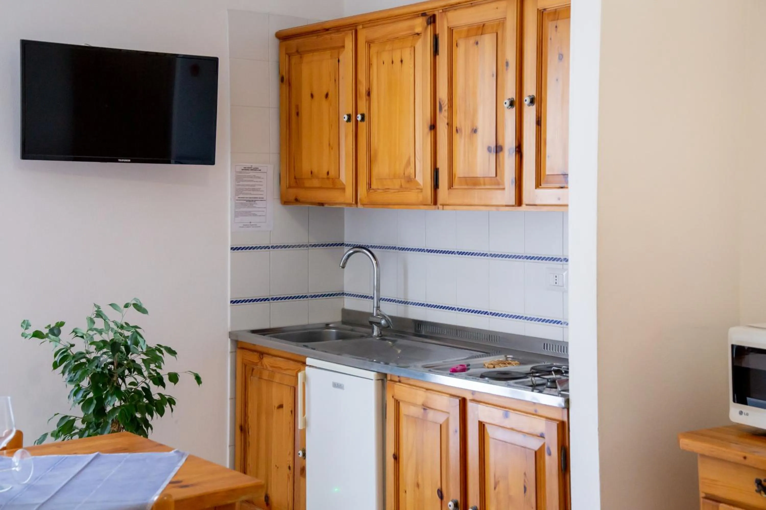 Kitchen or kitchenette in Gardenia Casa Vacanze