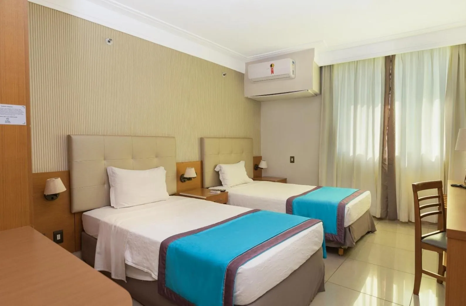 Bed in Royal Macaé Palace Hotel