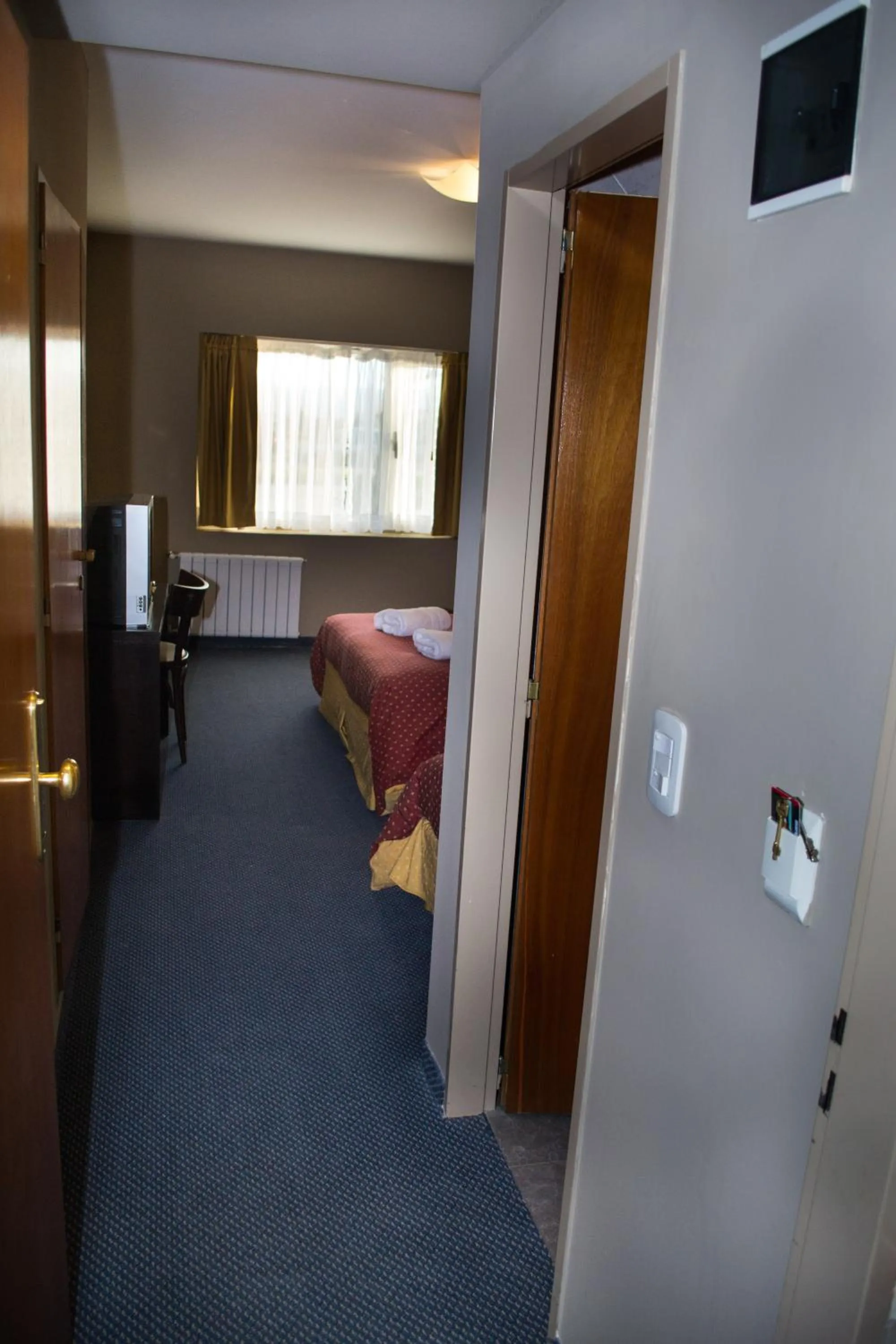 Bed in Marcopolo Suites Calafate