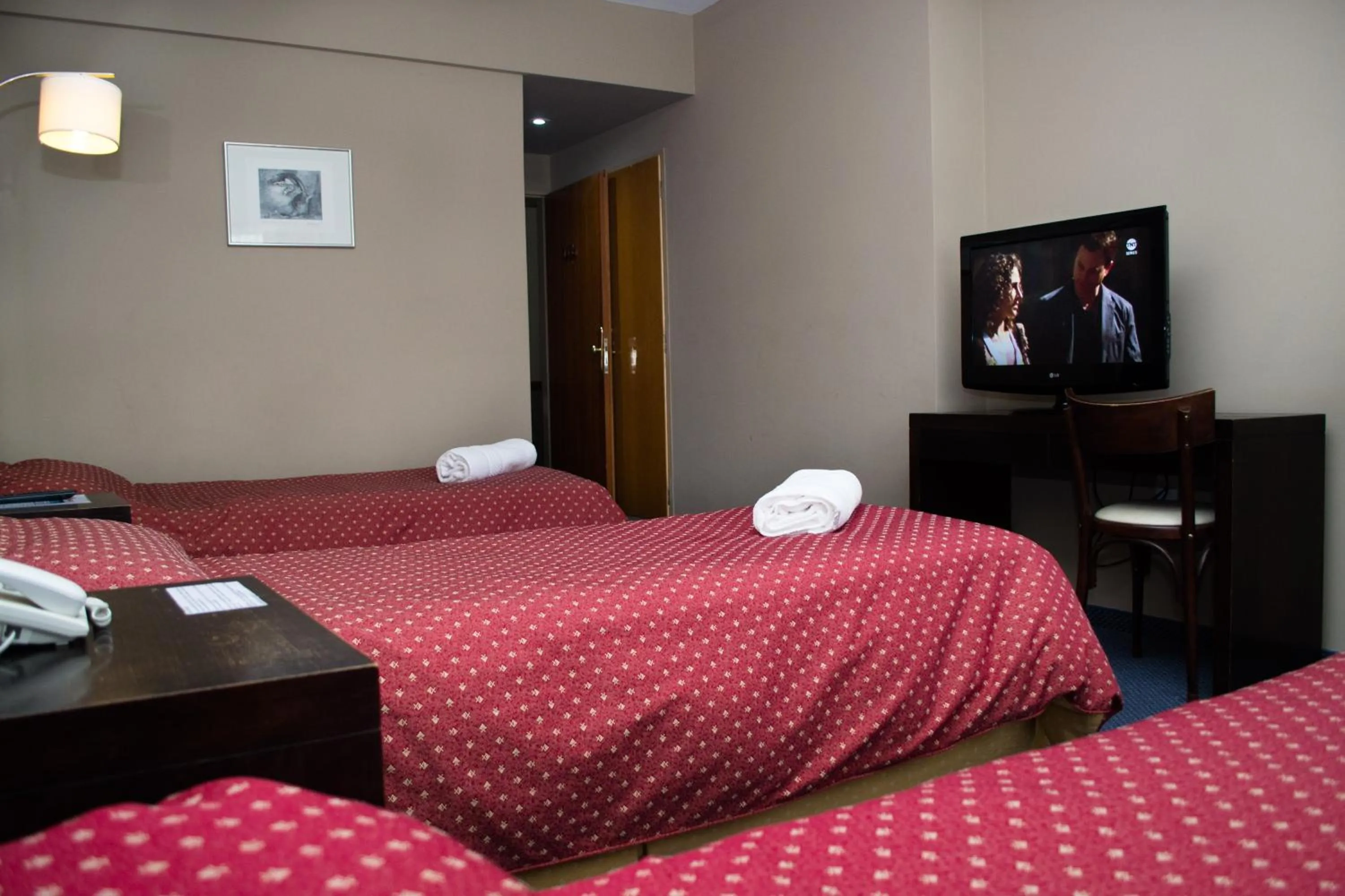 Bed in Marcopolo Suites Calafate