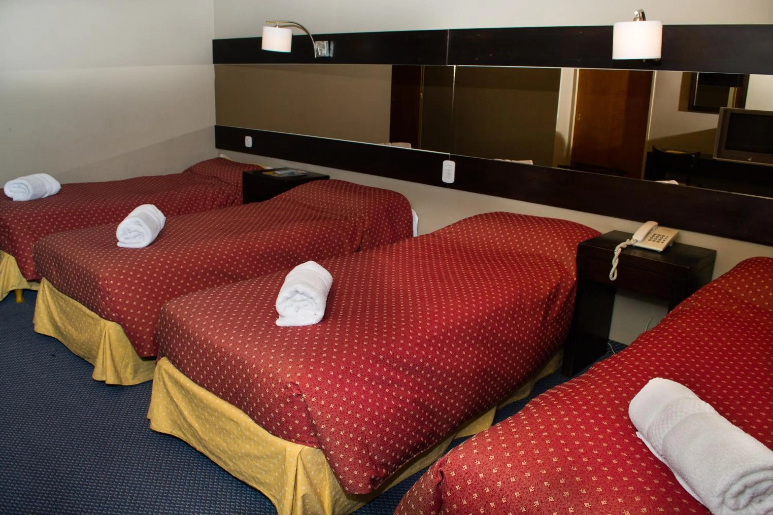 Bed in Marcopolo Suites Calafate