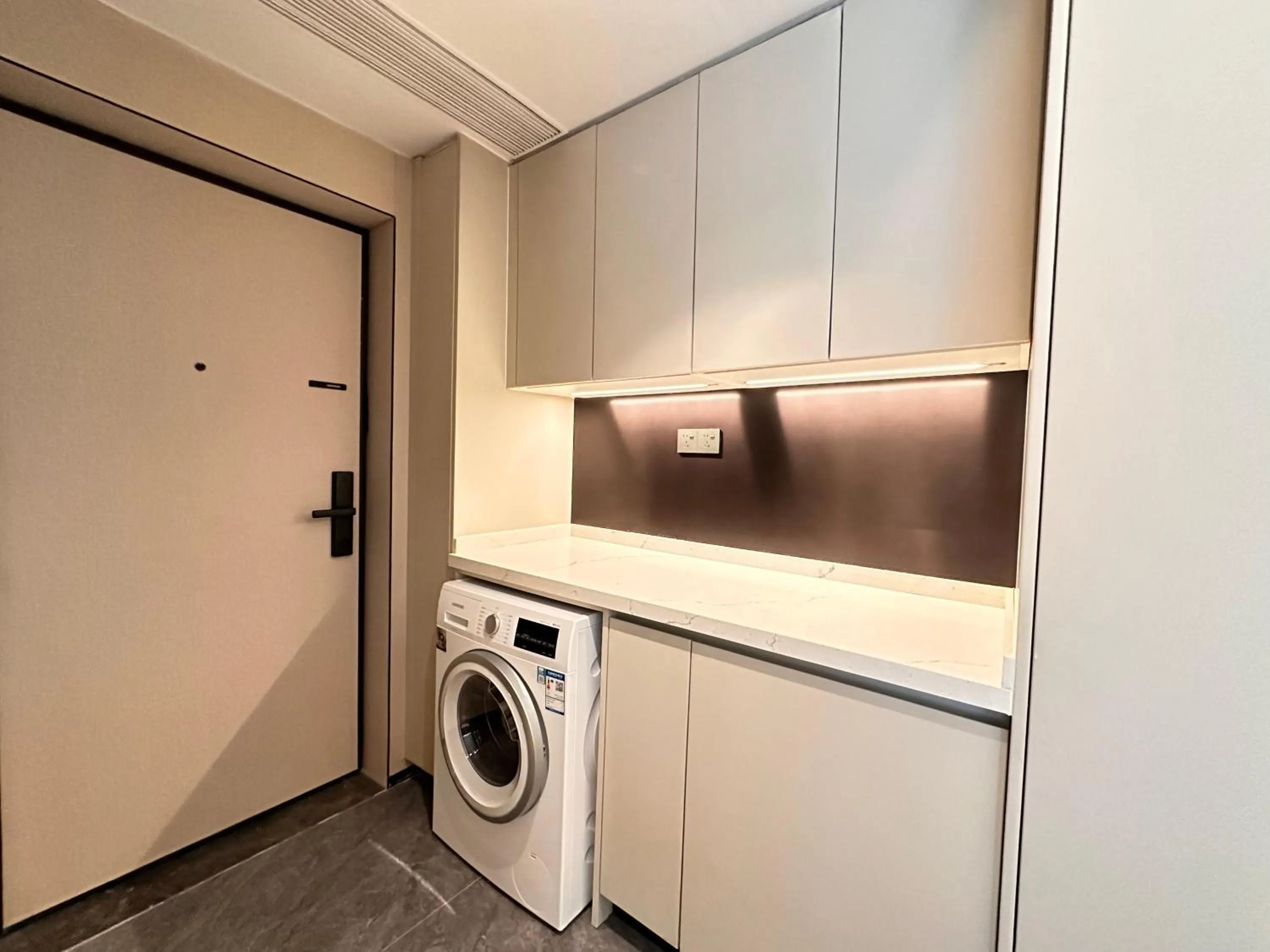 washing machine in CM+ Service Apartment Shenzhen Taige