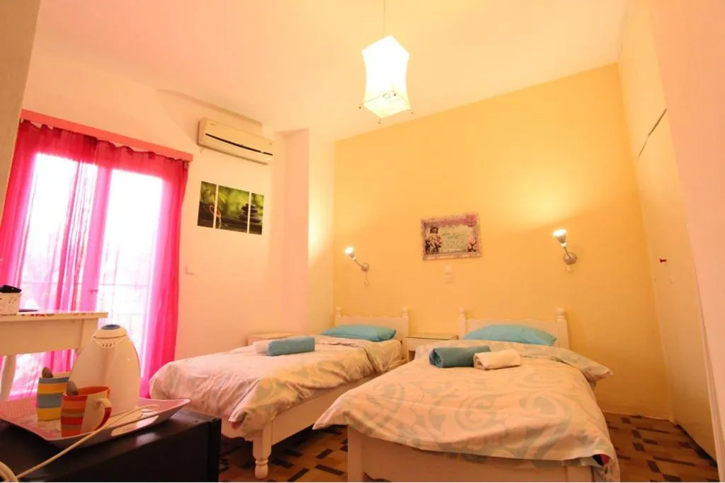 Bed in Avra Budget Beach Rooms