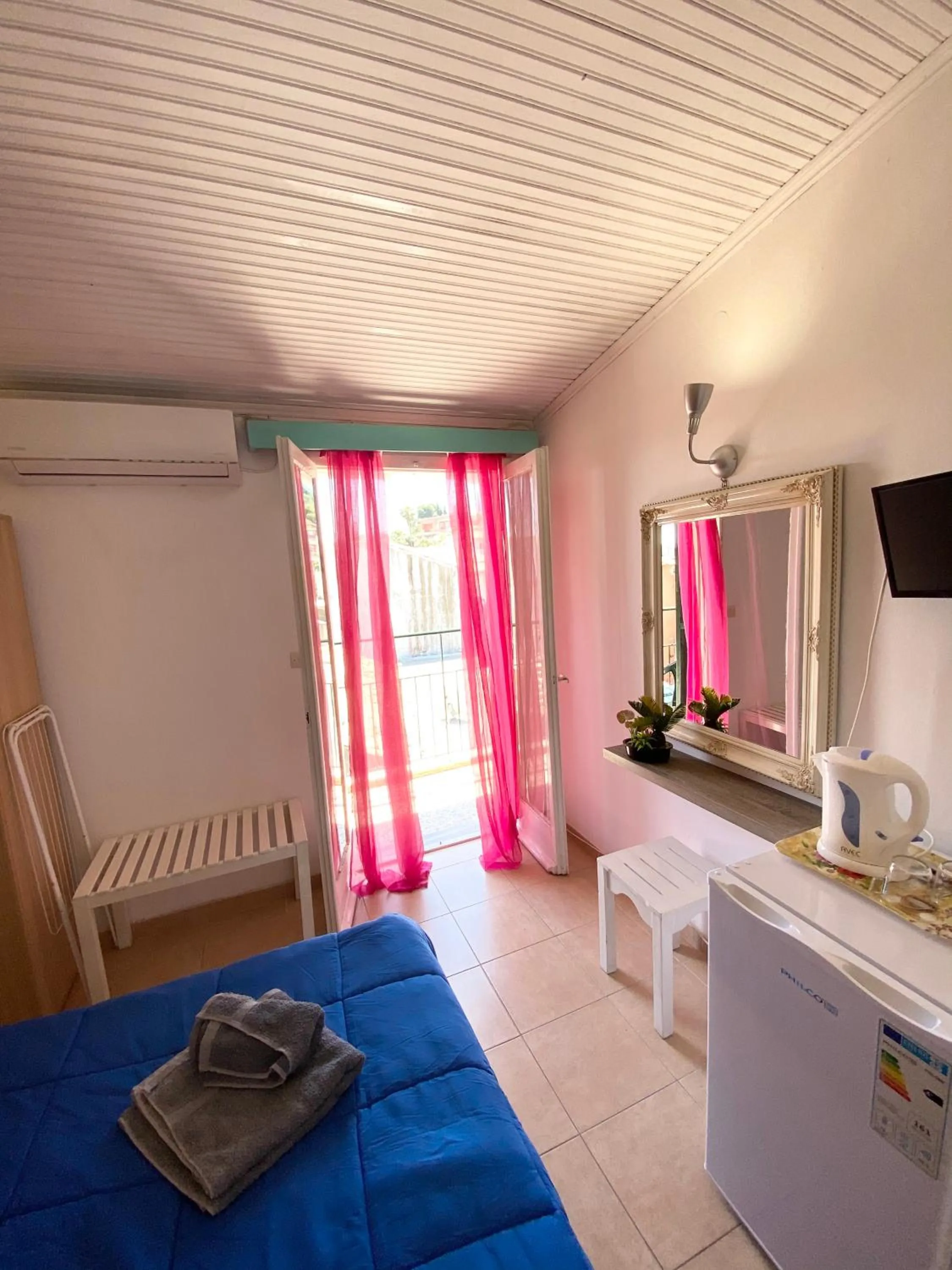 Bed in Avra Budget Beach Rooms